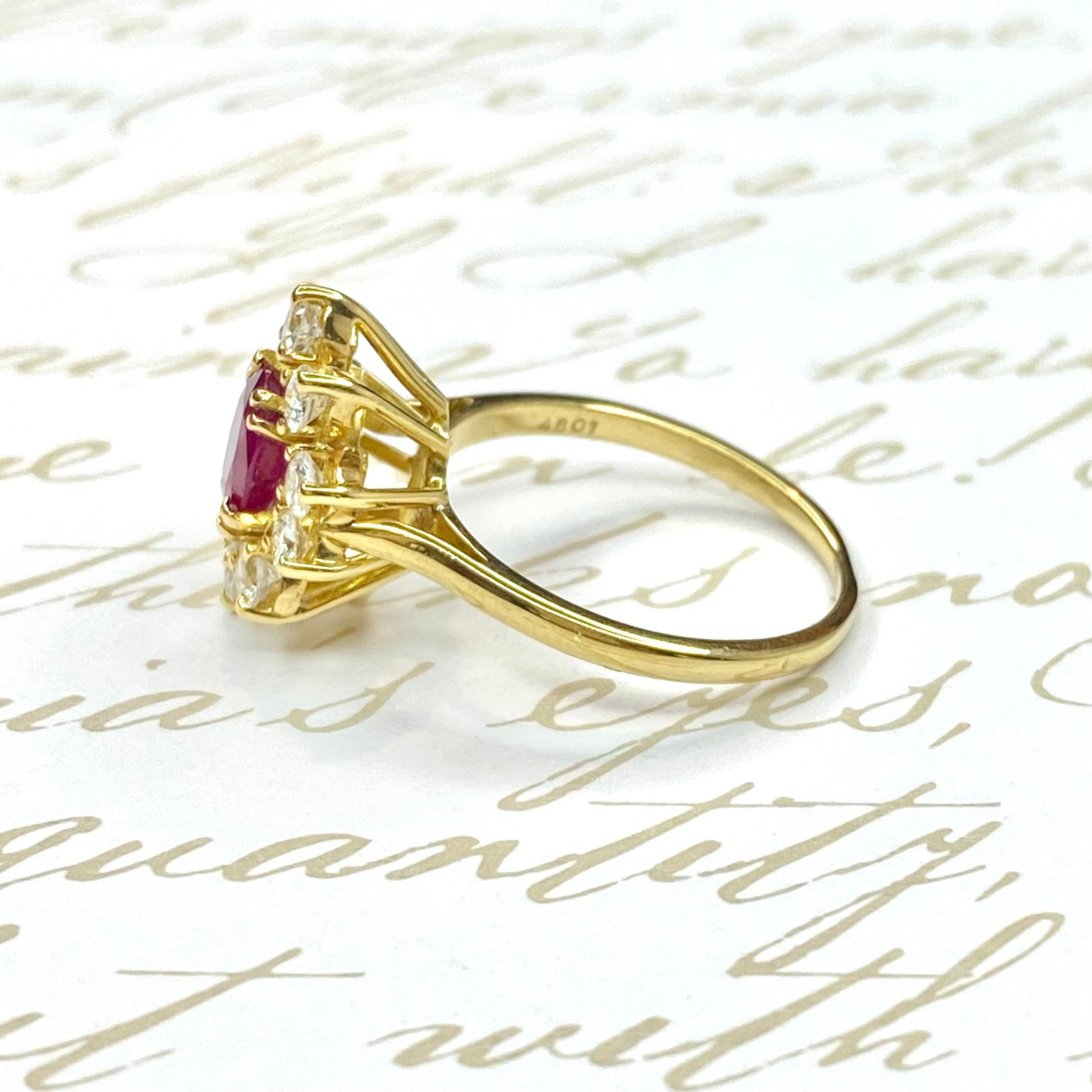 Crafted in 18K yellow gold, the ring features an oval GIA certified Burmese ruby set within a bezel of round brilliant cut diamonds. 
Ruby: 0.80 ct. (GIA certificate listed under images)
10 Diamonds: 0.60 ctw. Color: F-G, Clarity: