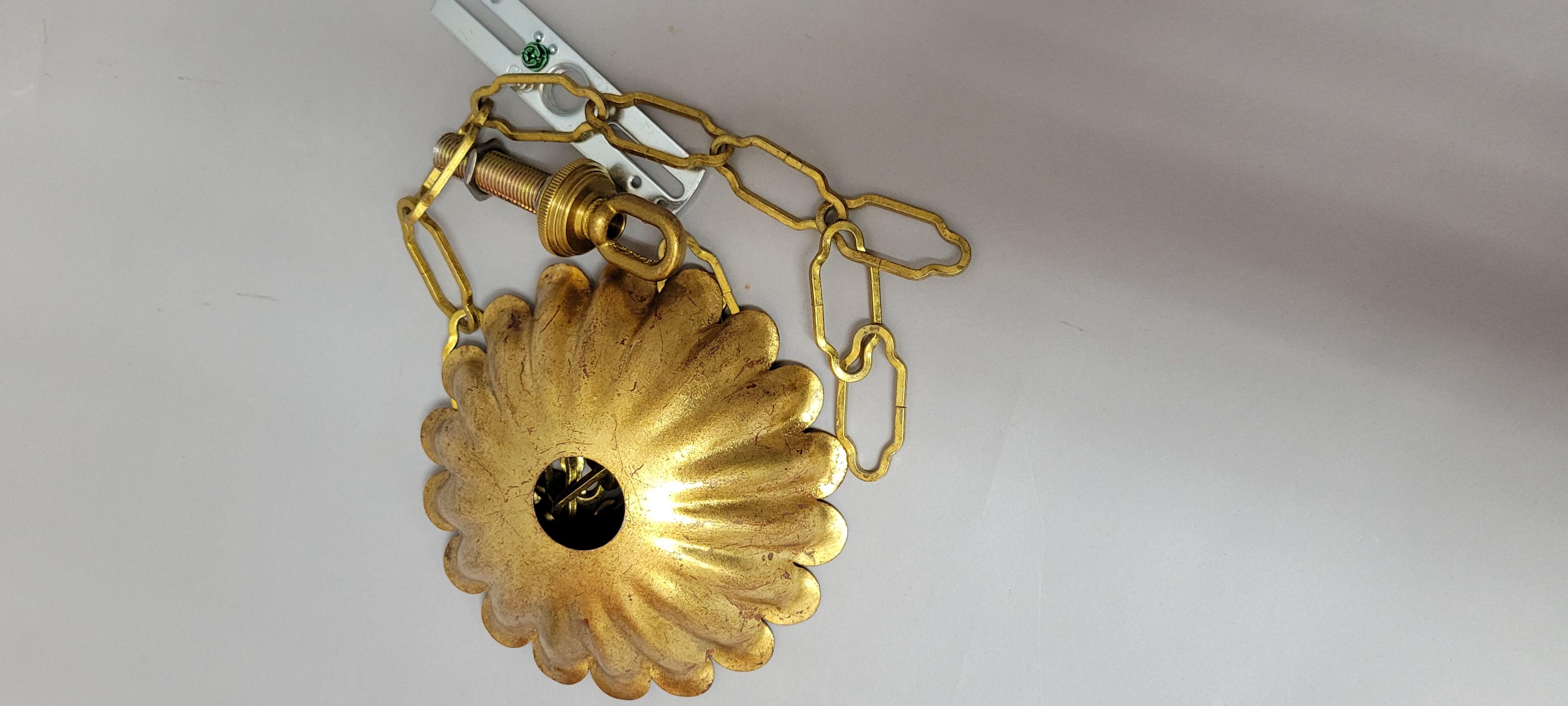 Vintage French Gilt Iron and Crystal Chandelier, 5-Light

This mid-century French-style chandelier is a stunning example of romantic vintage lighting, featuring a scrolled gilt iron frame and cascading crystal teardrop prisms. With its tulip crown