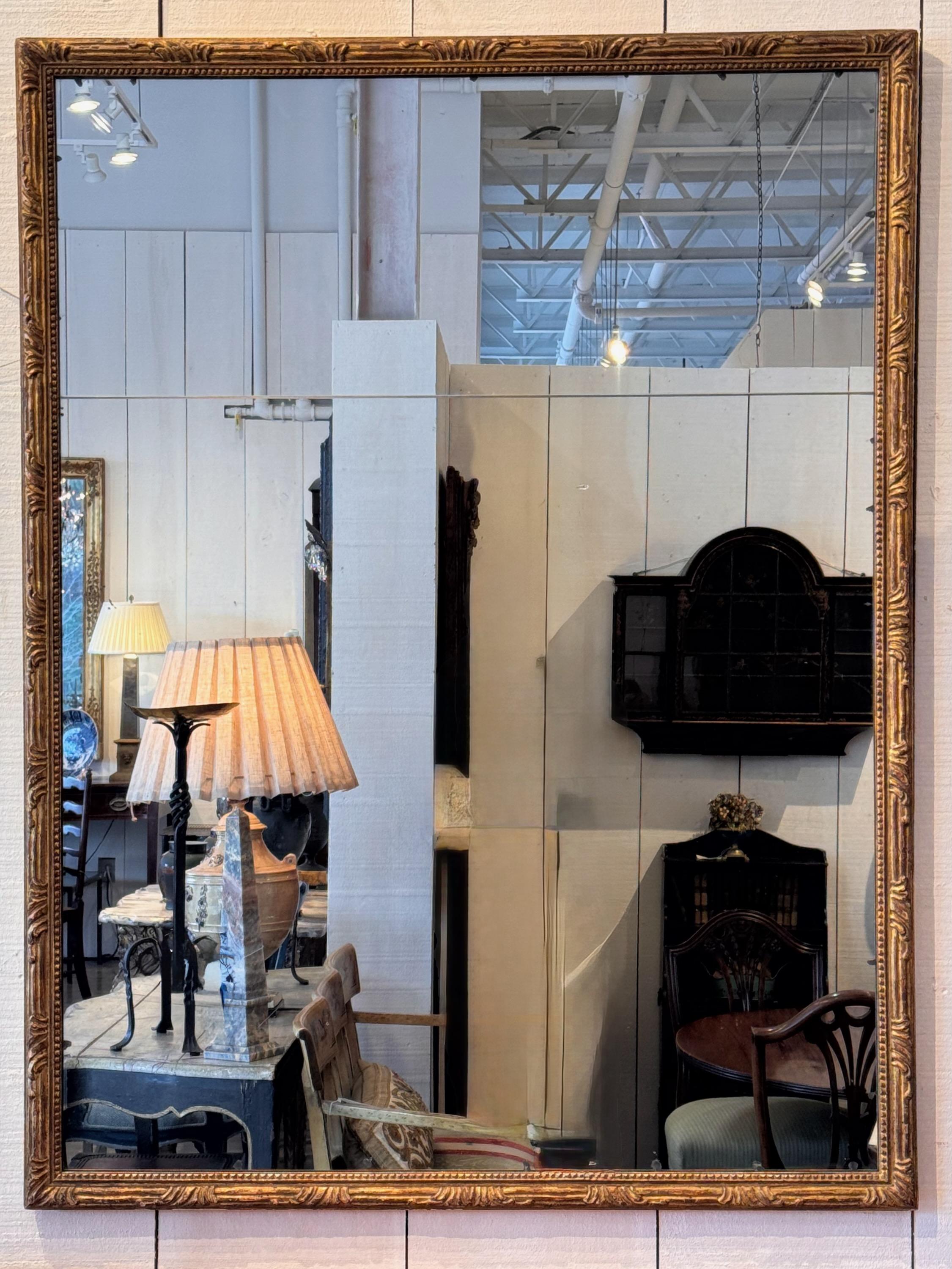 A nice carved mirror. Two part glass.