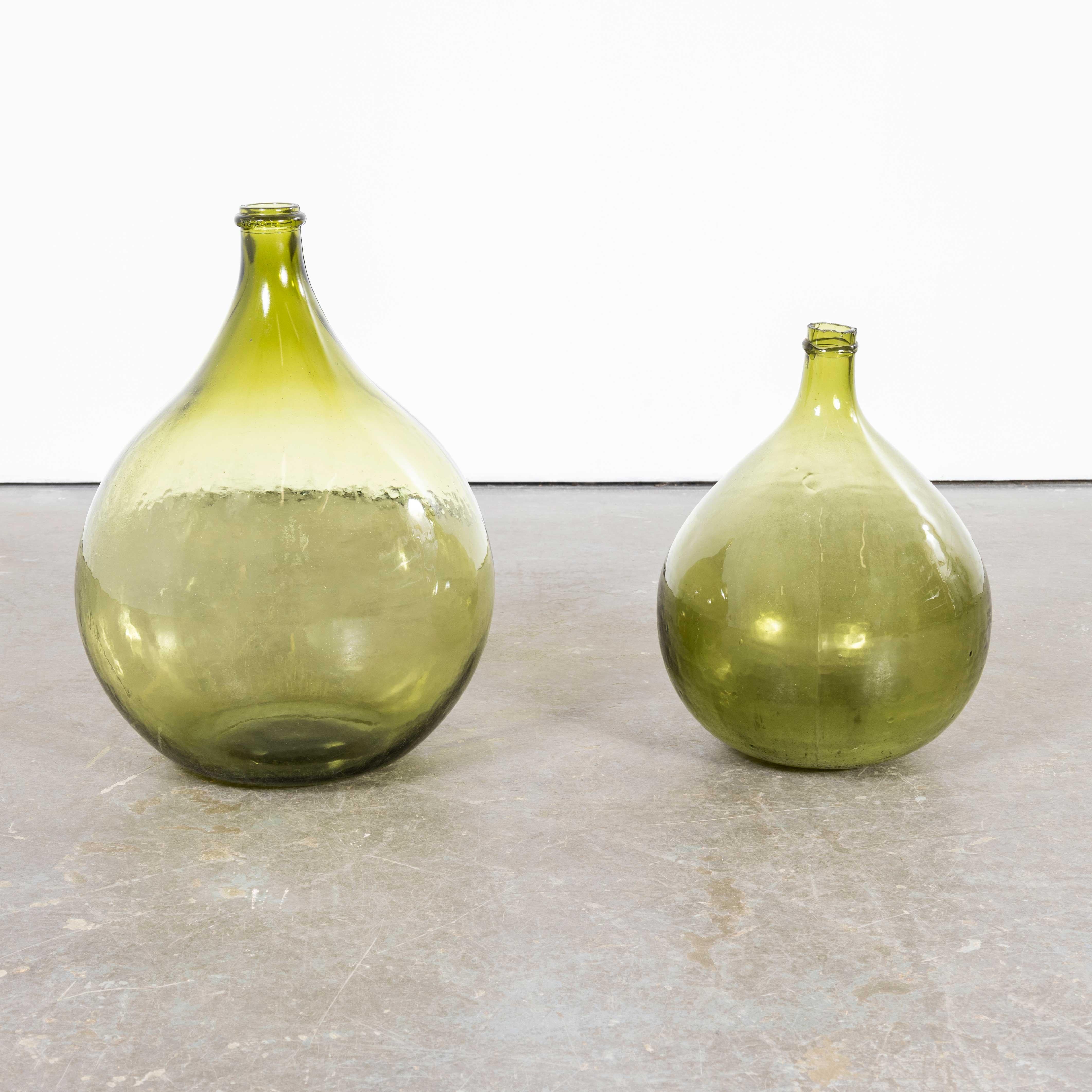 Vintage French Glass Demijohns – Pair (957.19)
Vintage French Glass Demijohns – Pair. A pair of mouth blown glass demijohns used as a traditional containers mainly for wine storage and transport. These demijohns have been carefully cleaned.