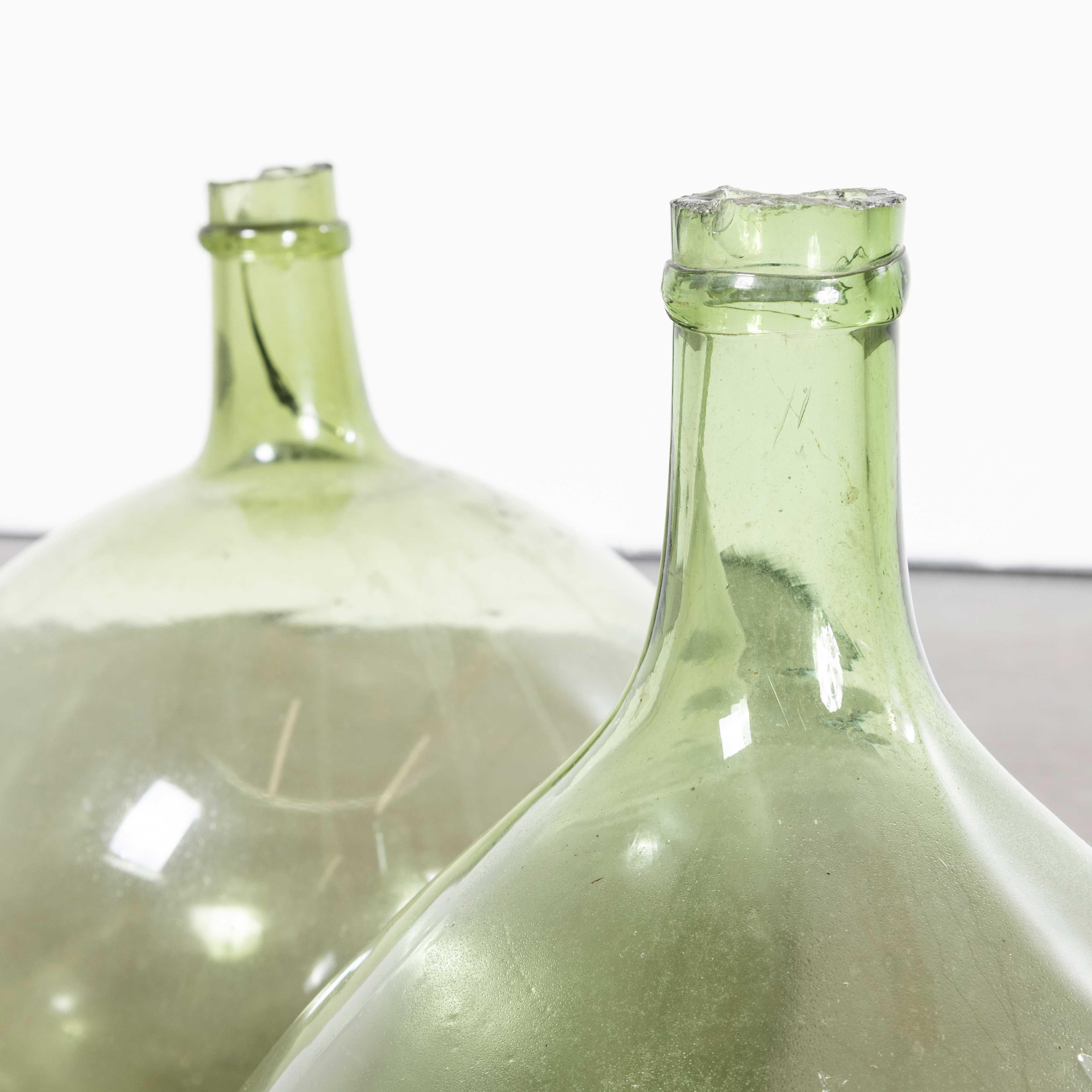 Vintage French Glass Demijohns – Pair (957.21)
Vintage French Glass Demijohns – Pair. A pair of mouth blown glass demijohns used as a traditional containers mainly for wine storage and transport. These demijohns have been carefully cleaned.