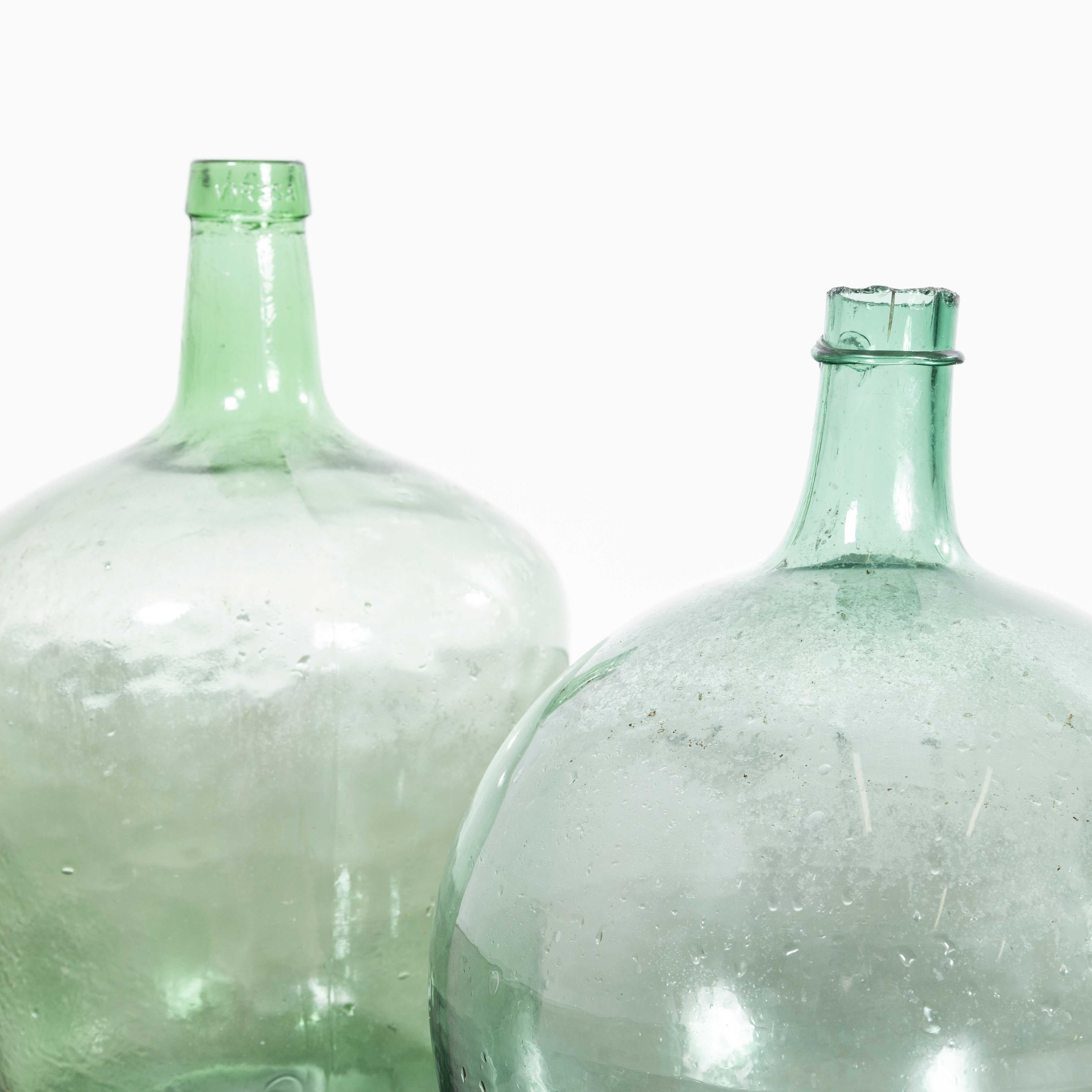 Vintage French Glass Demijohns – Pair (957.23)
Vintage French Glass Demijohns – Pair. A pair of mouth blown glass demijohns used as a traditional containers mainly for wine storage and transport. These demijohns have been carefully cleaned.