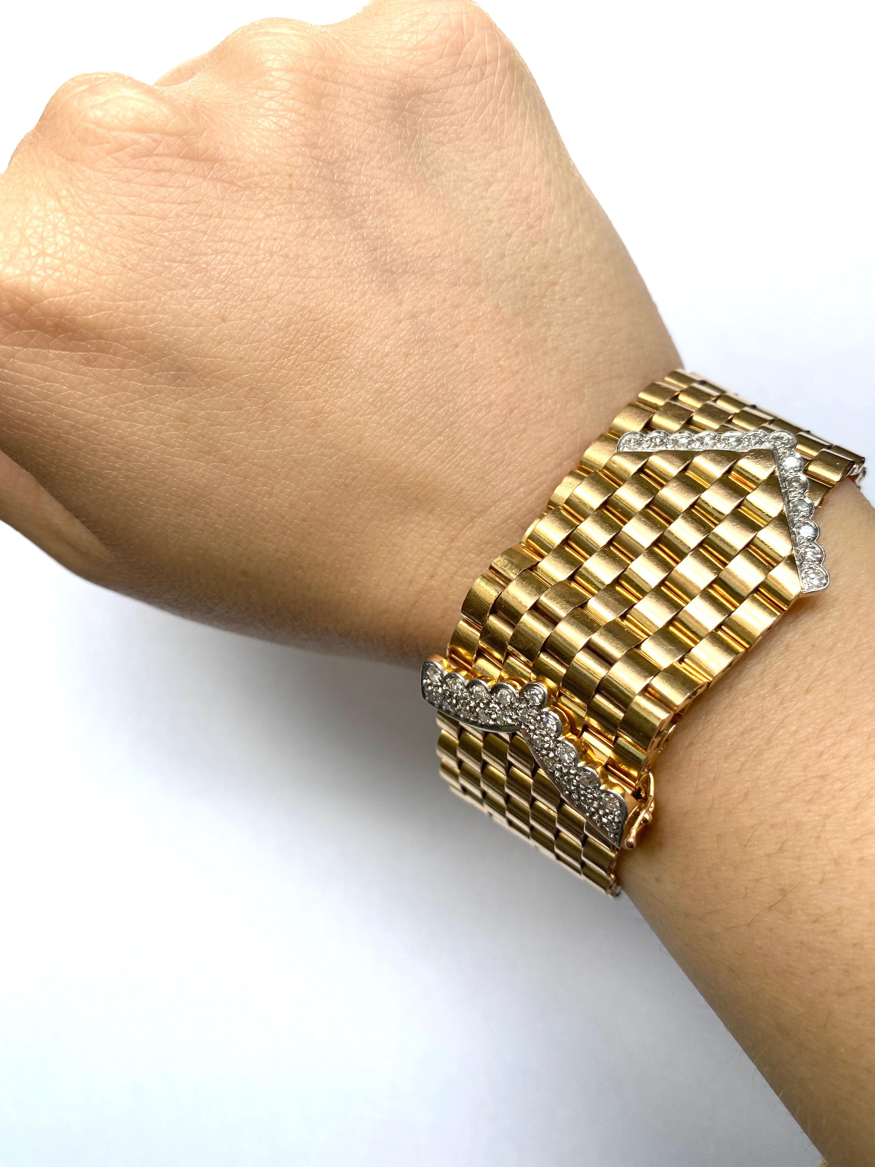 A vintage, wide belt and buckle design bracelet, comprised of seven rows of brick-style links, with two single-cut diamond set 