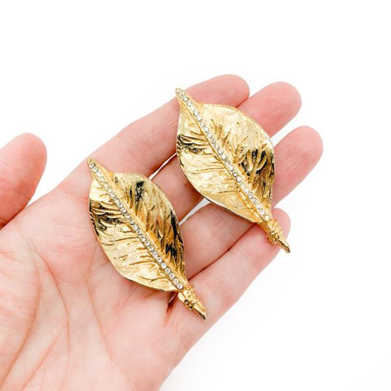 A seriously stylish pair of Vintage French Leaf Earrings. Featuring a wonderfully cast gold plated leaf design adorned with a central strip of glass crystals. In very good condition, 6.3cms. We love these earrings for their exceptional style,