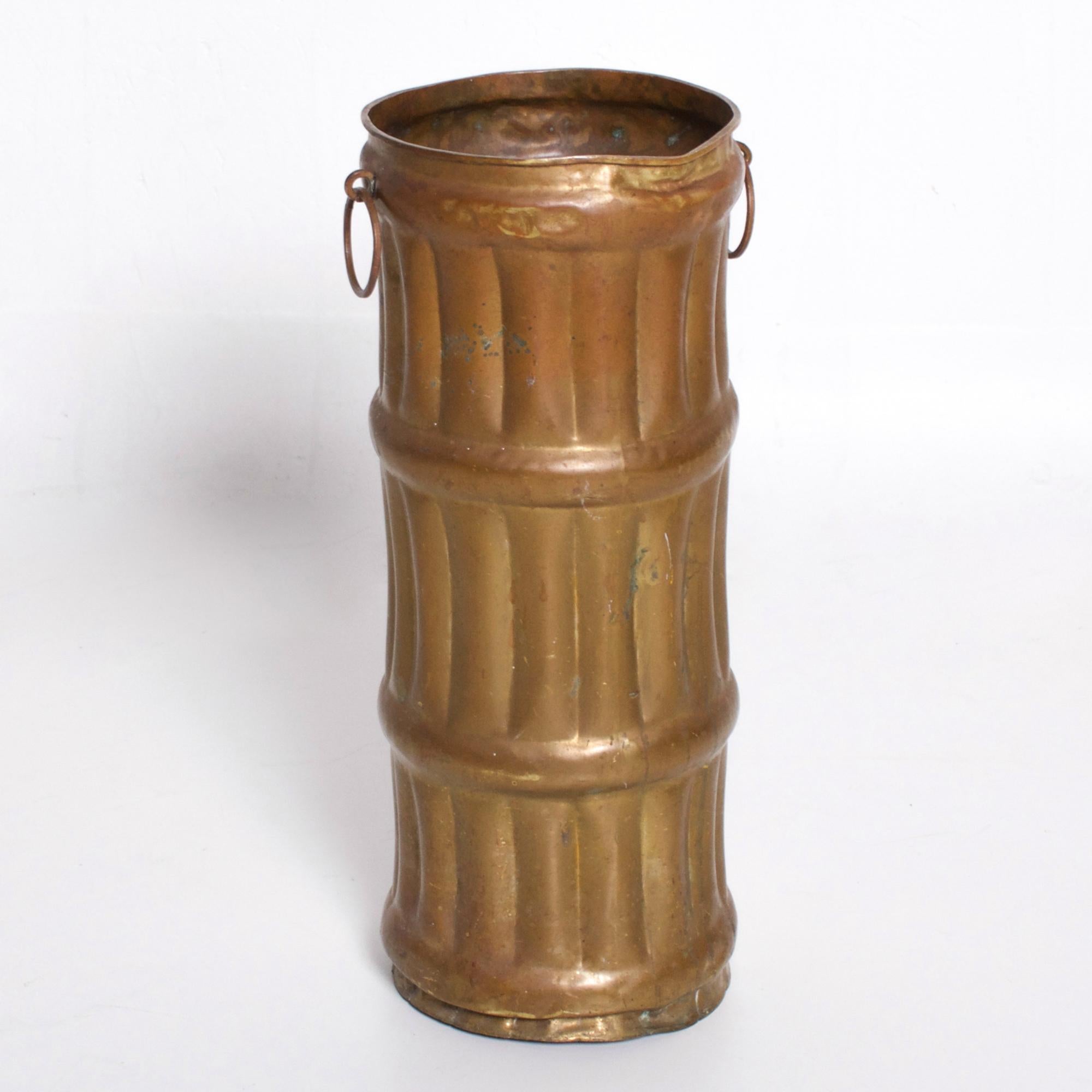 Umbrella Stand
Vintage French Hollywood Regency Brass Faux Bamboo Umbrella Stand.
Crafted in Solid Brass wonderful vintage patina present.
Simple design faux bamboo two brass ring holders at each side.
In the manner of Mathieu Mategot.
No markings