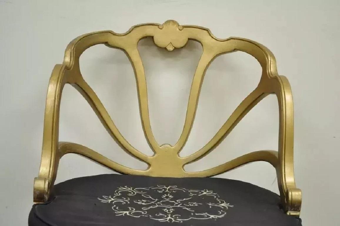 Vintage French Hollywood Regency Gold Shell Carved Boudoir Slipper Accent Chair. Item features a shapely openwork shell form back, elegant cabriole legs, original label, and desirable distressed gold painted finish. Circa Mid 20th Century.