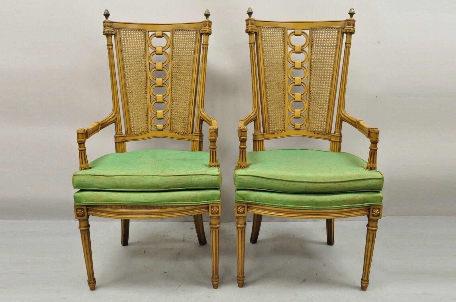 Vintage French Hollywood Regency tall cane back carved link chairs - a pair. Item features cane back, brass finials, solid wood frame, beautiful wood grain, nicely carved details, tapered legs, very nice vintage pair, great style and form. Circa Mid