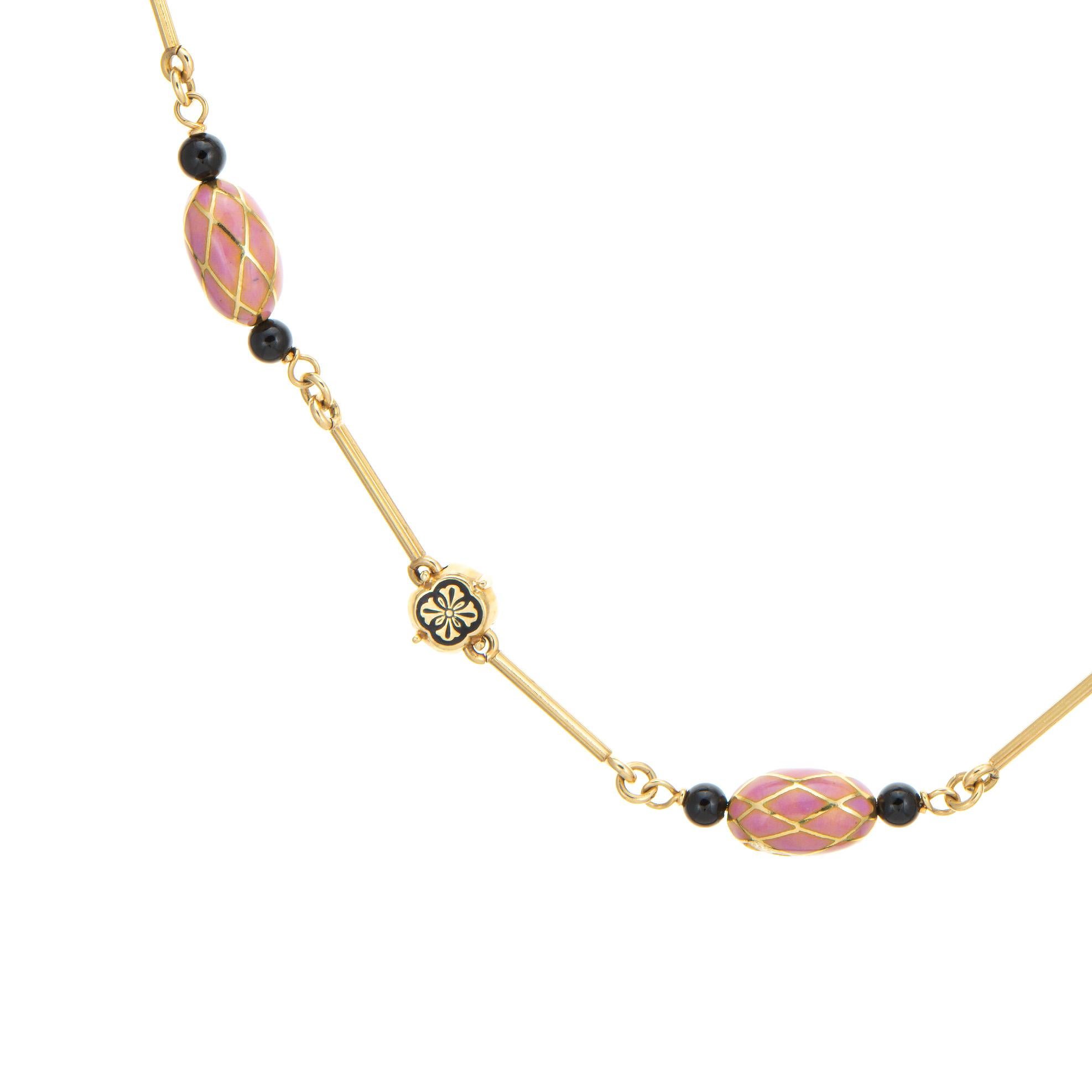 Stylish and finely detailed vintage French import necklace (circa 1960s to 1970s) crafted in 18 karat yellow gold. 

The beautifully crafted necklace features pink enameled orbs framed with black onyx beads to both ends, with an alternating pattern