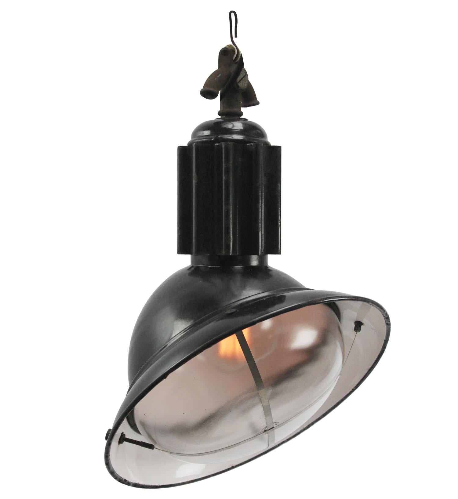 French asymmetrical black industrial lamp with round clear glass.
Black enamel. Rare model.

Weight: 4.10 kg / 9 lb

Priced per individual item. All lamps have been made suitable by international standards for incandescent light bulbs,
