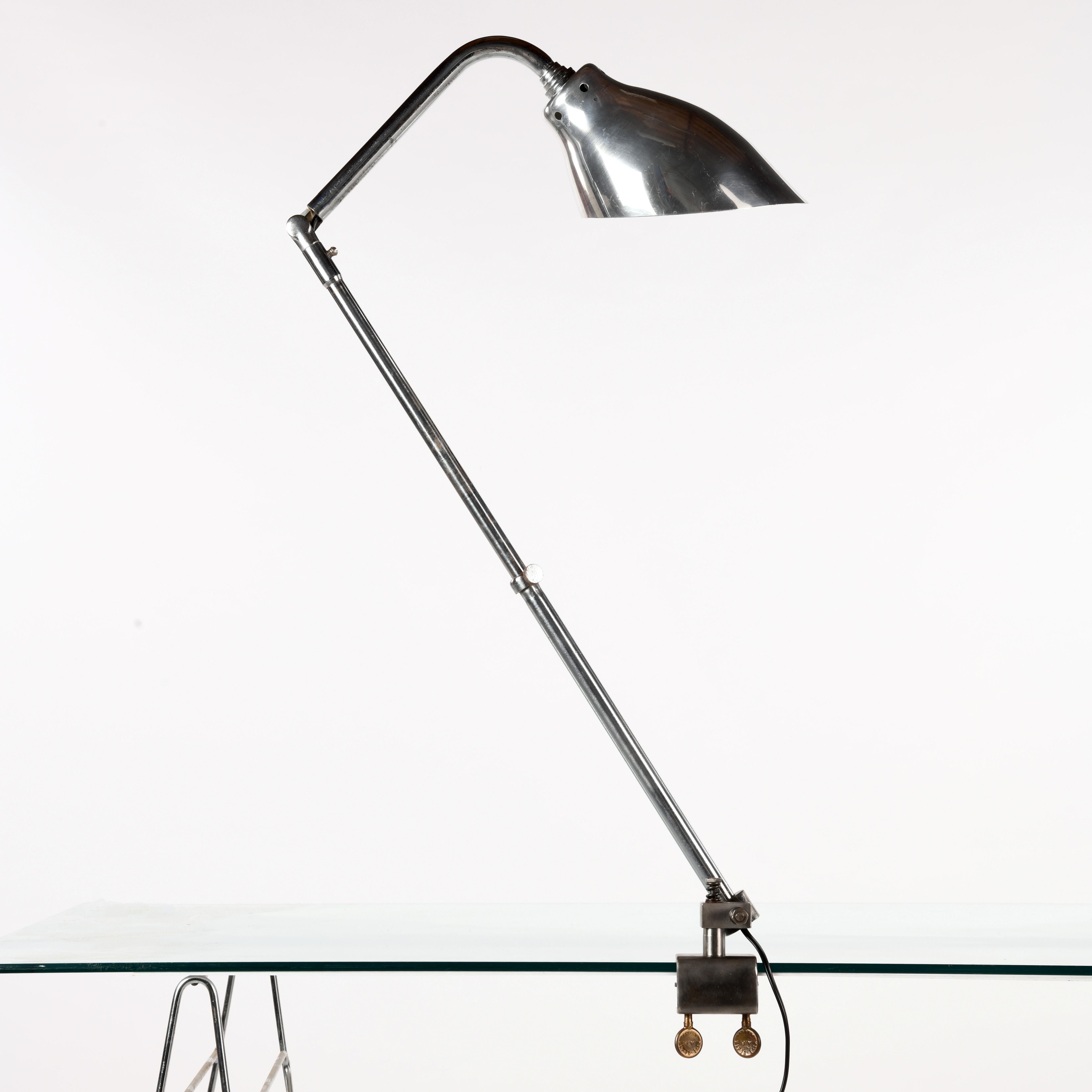 Ki-E-Klair lamp made in the 1960s by Alphonse Pinoit and his son André Pinoit. This model has a vice, swivels in all directions and is telescopic. It is fitted with a truncated cone-shaped aluminium shade, model no. 210 (some signs of use and chrome