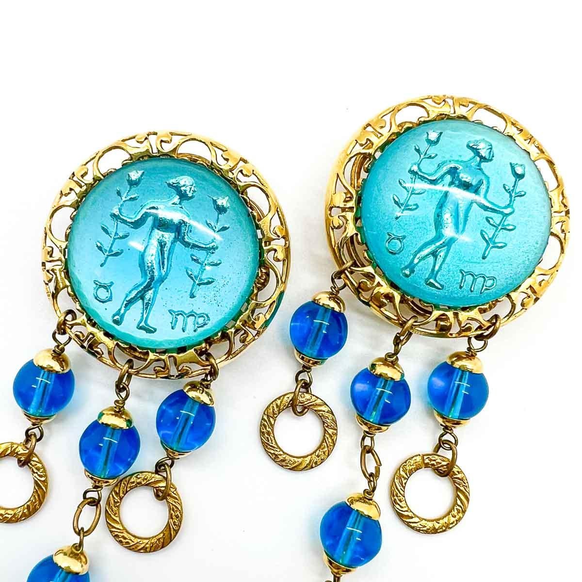 A spectacular pair of French Vintage Aqua Intaglio Earrings. Featuring a huge reverse carved convex glass intaglio. Dropping away are chased golden rings with matching deep turquoise blue balls. The backs of these earrings are as detailed and
