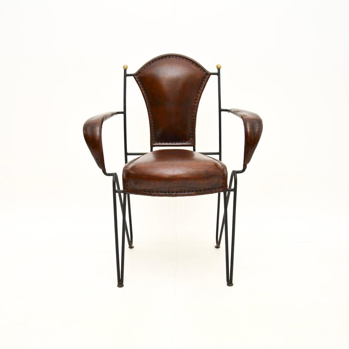 A stunning vintage French iron and leather armchair, dating from around the 1960’s. It is a great size for use as a desk chair or an occasional side chair.

This model is often attributed to Jacques Adnet, it is of superb quality and is extremely