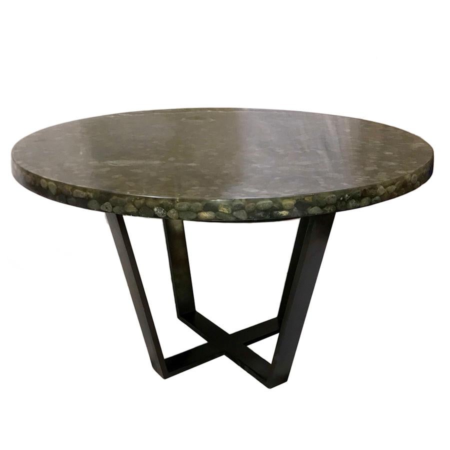 A circa 1960's French center table with iron base and river stones in resin top. 

Measurements:
Height: 30