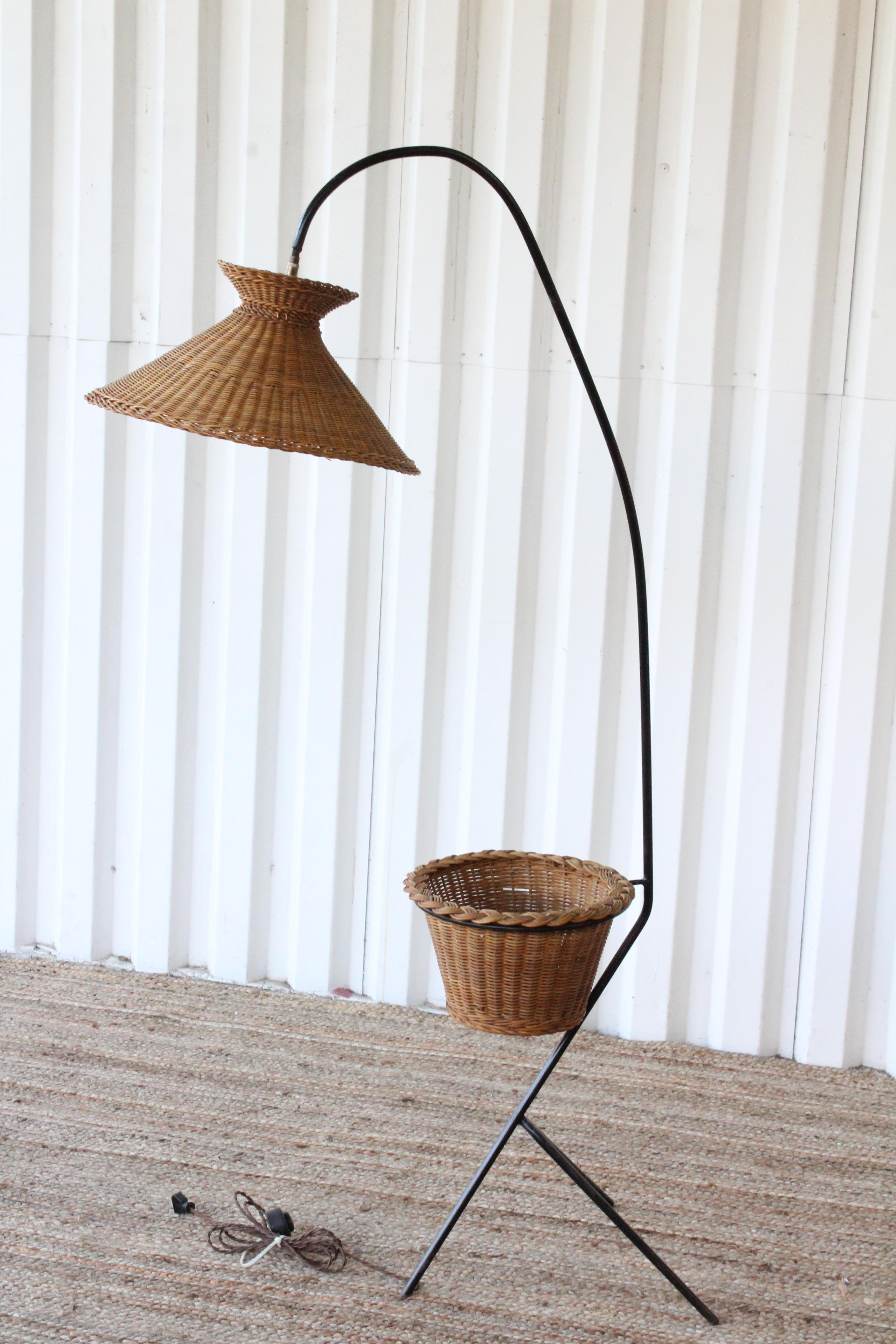 Vintage iron floor lamp with original wicker shade and basket, France, 1950s. Newly rewired.