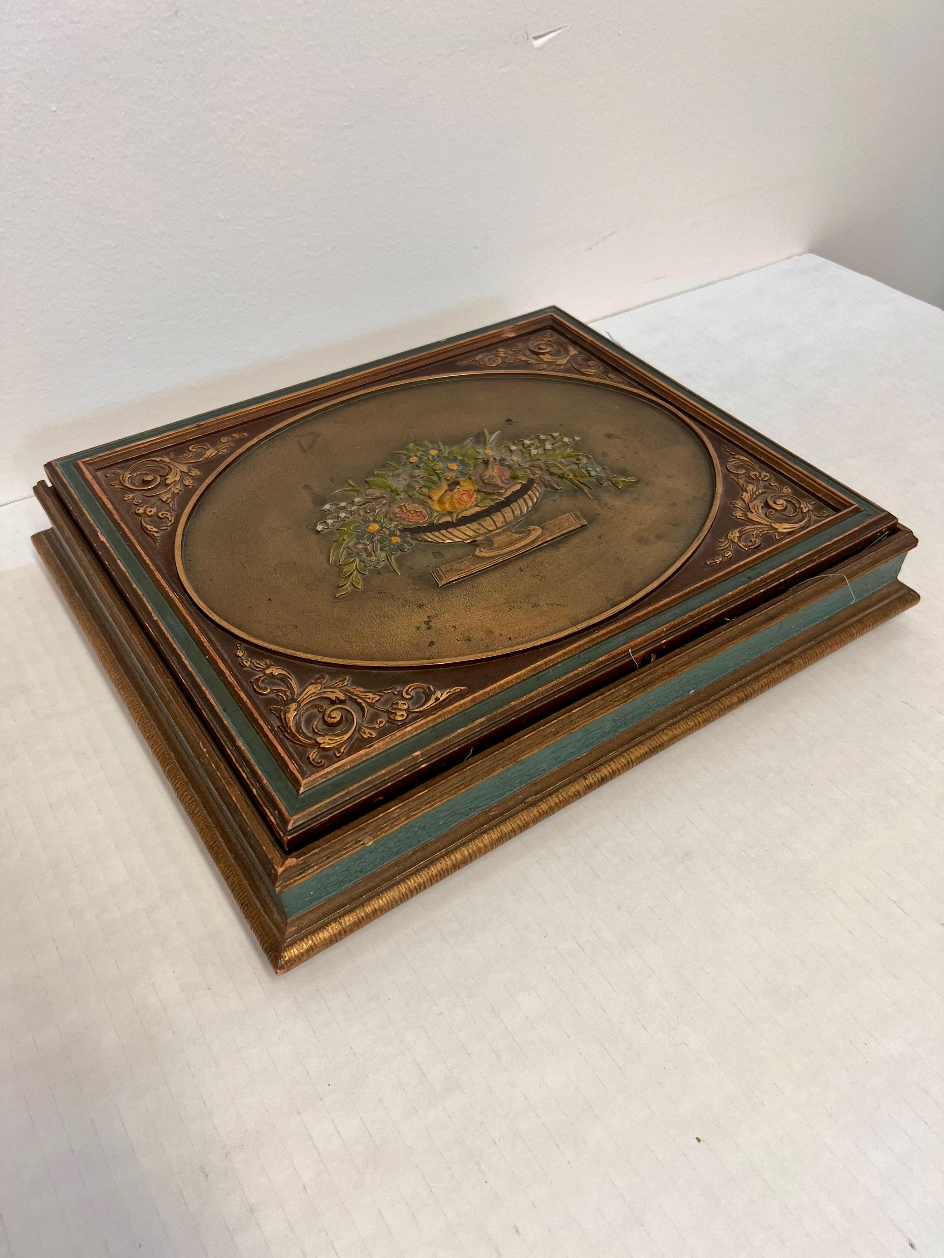  This French-Italian style marquetry jewelry accessory box features exquisite craftsmanship and intricate design. The exterior showcases a beautifully detailed carved top, adorned with a floral arrangement in a decorative vase, highlighting the