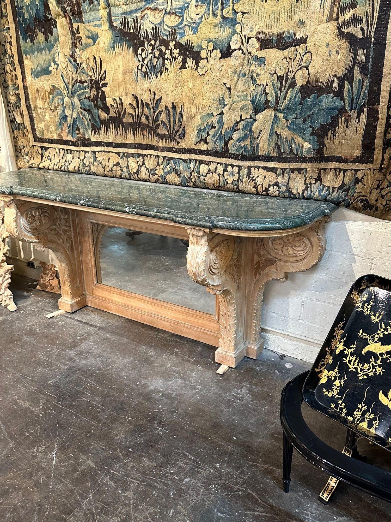 Vintage French Jansen carved and stripped pine marble top console, circa 1940. Adds warmth and charm to any room!