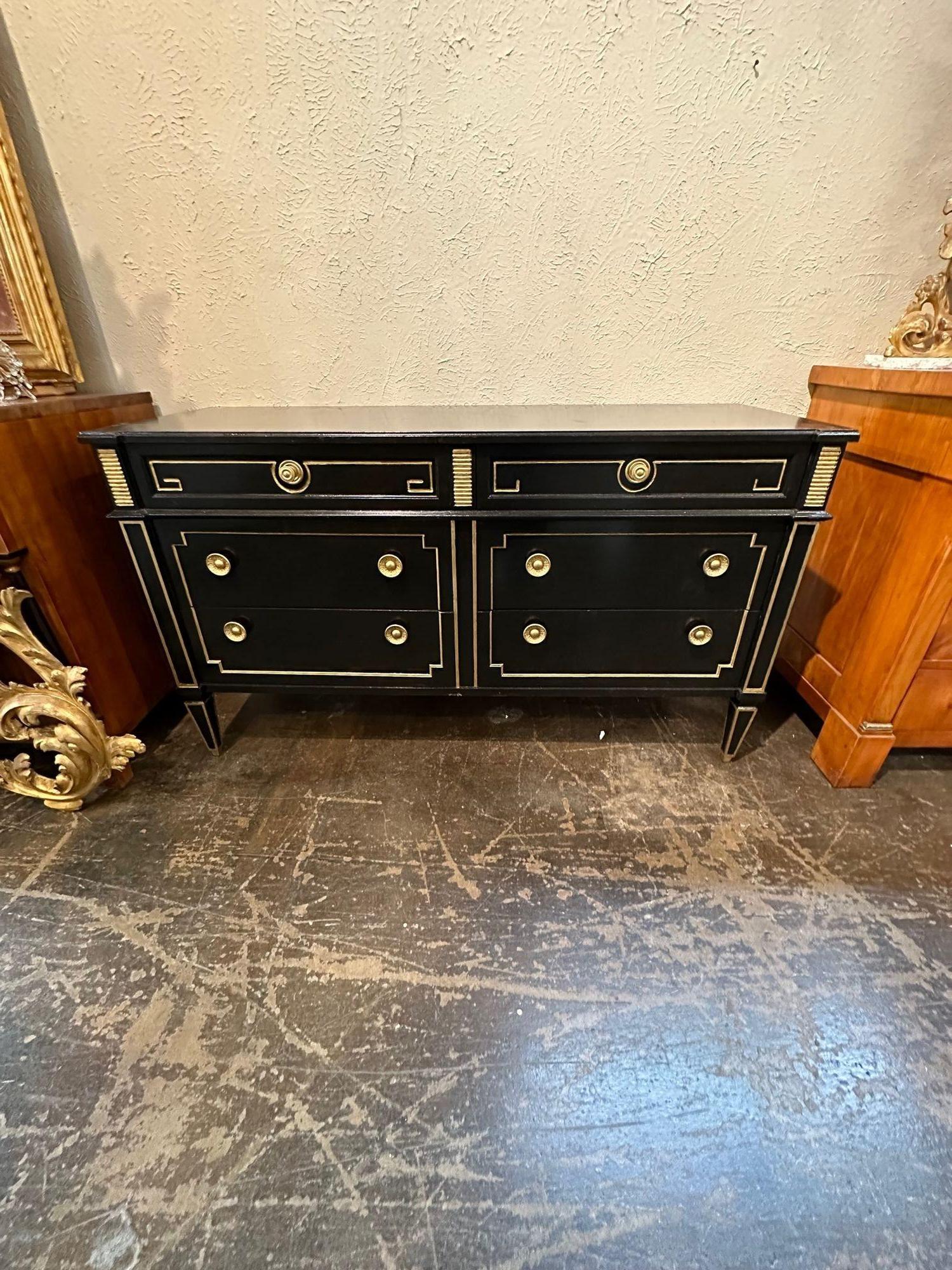 Gorgeous vintage French Jansen Louis XVI style black lacquered and gilded dresser. Featuring a very polished finish, beautiful hardware and pretty gold gilt details. This piece would also work as a sideboard. Perfect for the traditional home! Lovely!