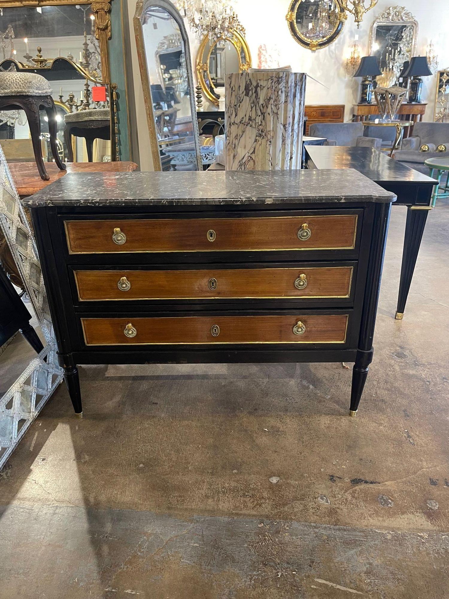 Very fine vintage French Jansen walnut and black lacquered Louis XVI style commode. This piece also has a beautiful marble top and lovely hardware. A true classic that is sure to impress!!