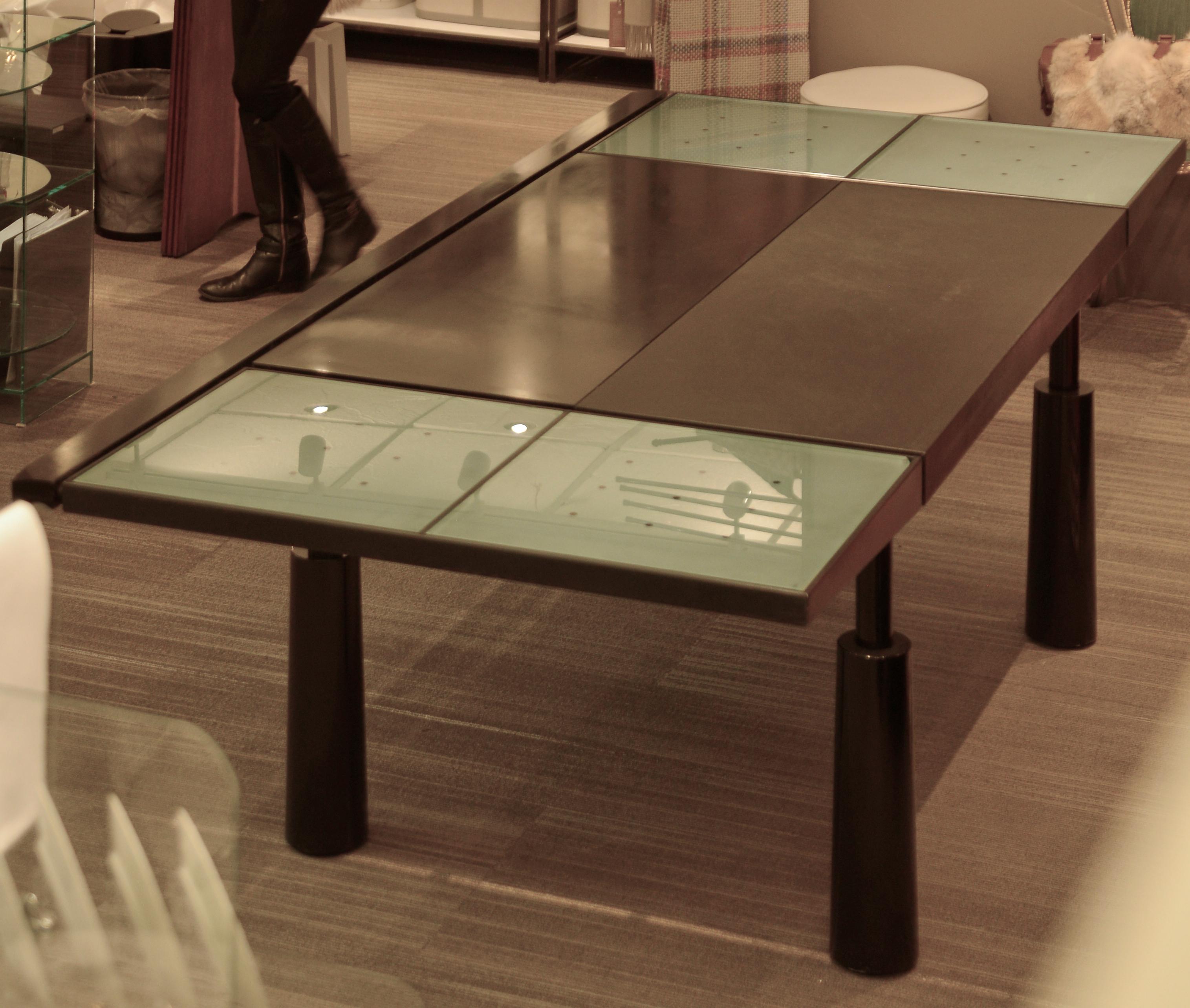 Vintage French black dining table featuring leather, metal, bronze, glass, and lacquer. Mosais by Jean-Louis Berthet.