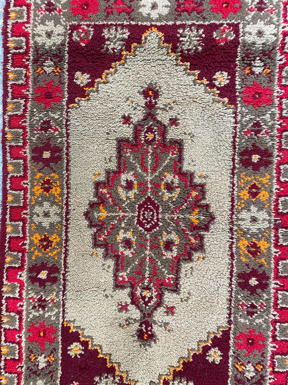 Beautiful midcentury French rug with a geometrical Turkish design and beautiful colors, entirely hand knotted with wool velvet on cotton foundation.