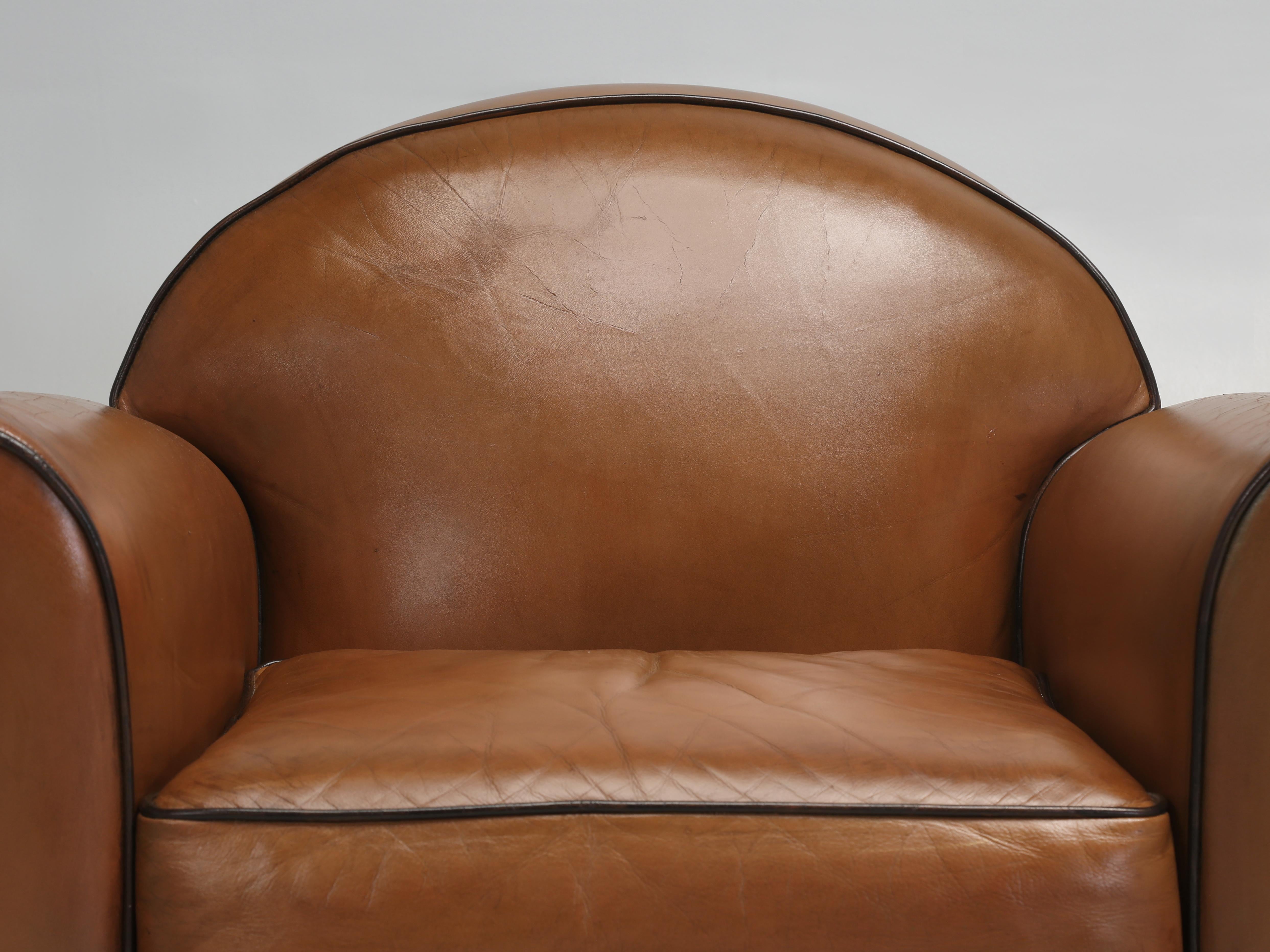 Vintage French Leather Club Chairs, produced by the French firm of HUGUES CHEVALIER of Paris, who also made the furniture for Cartier’s Head Office in Paris. Mr. Hugues Chevalier designs were inspired from the Art Deco period and this particular