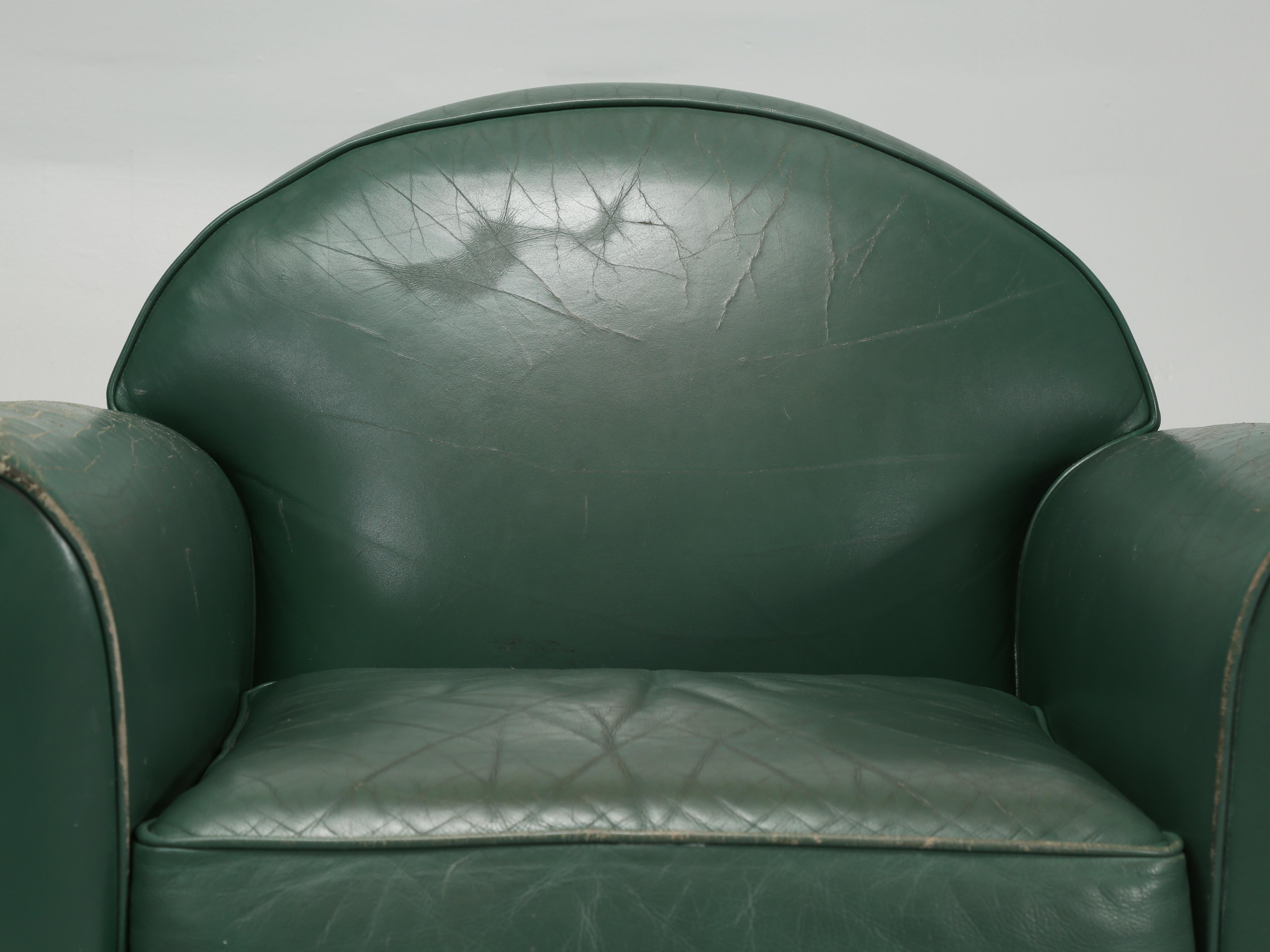 Vintage French leather club chairs, produced by the French firm of HUGUES CHEVALIER of Paris, who also made the furniture for Cartier’s Head Office in Paris. Mr. Hugues Chevalier designs were inspired from the Art Deco period and this particular