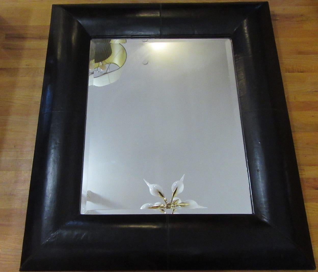 Beautifully crafted black leather mirror made in France.