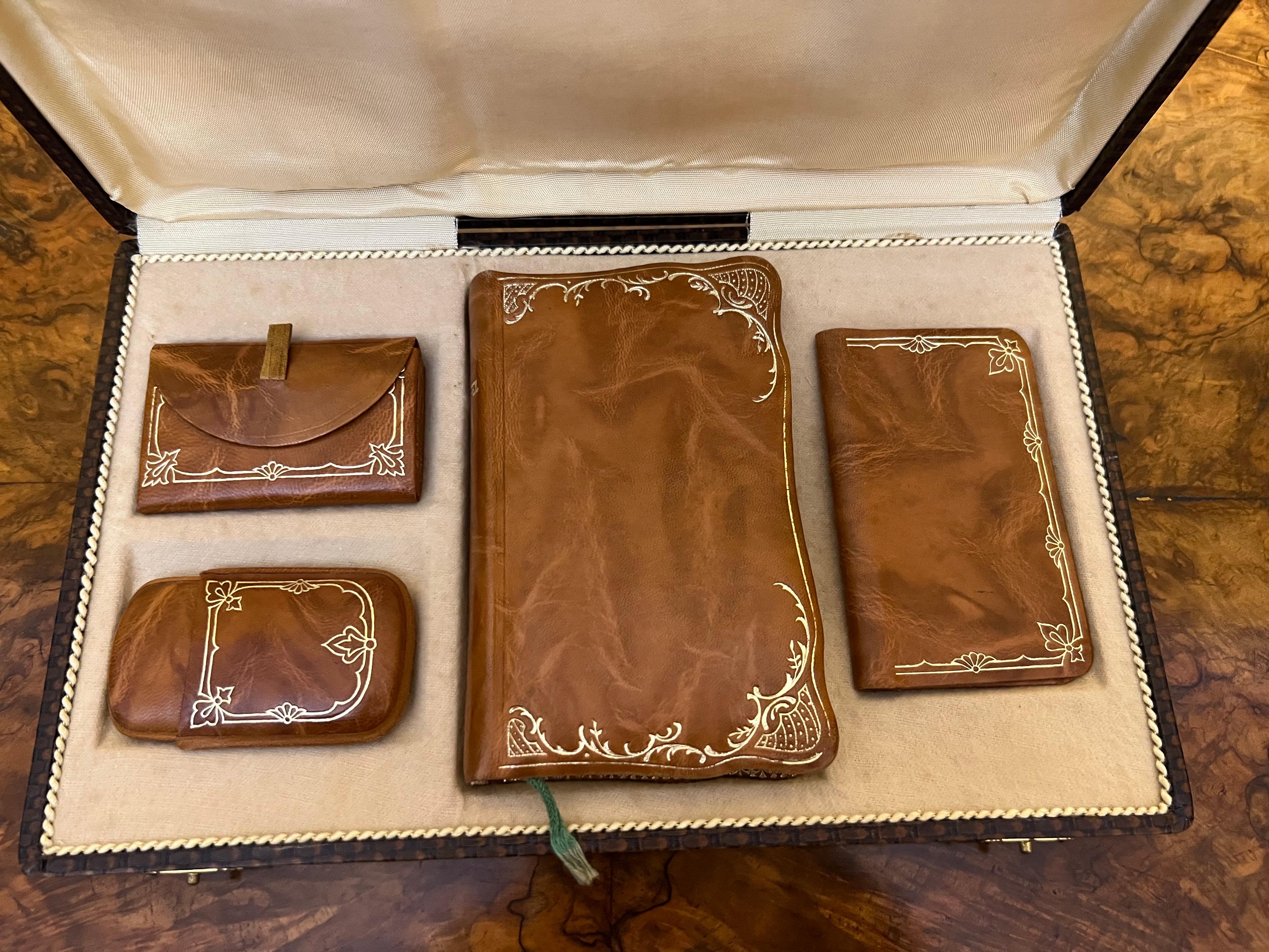 Beautiful brown leather with gold detail trim, comes with a L'Adoration Book, small money wallet, small coin purse and small pocket. never been used kept in its box. Book is dates 1930. 

Circa: 1930

Material: Leather

Country Of Origin: 