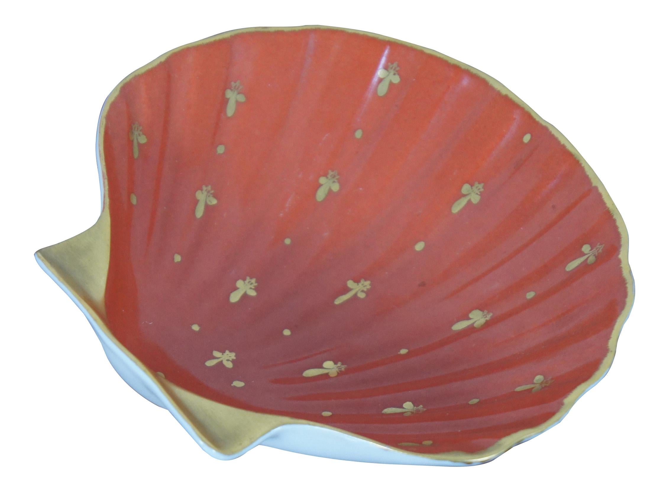 Vintage Limoges France porcelain scalloped shell shaped trinket dish, hand painted red with gold fleur de lis. Measures: 6