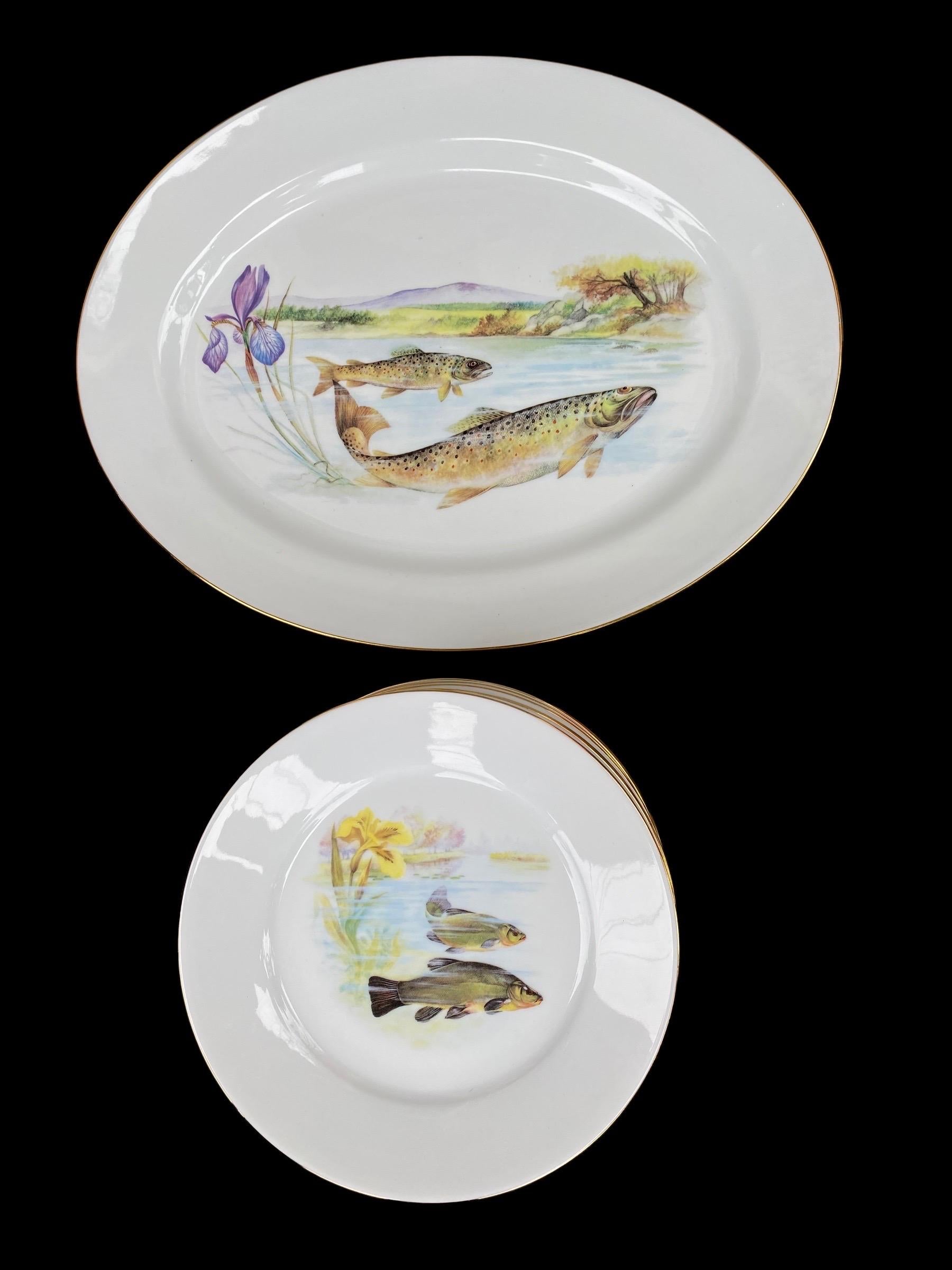 A vintage Limoges fish set consisting of one serving platter, 15.75