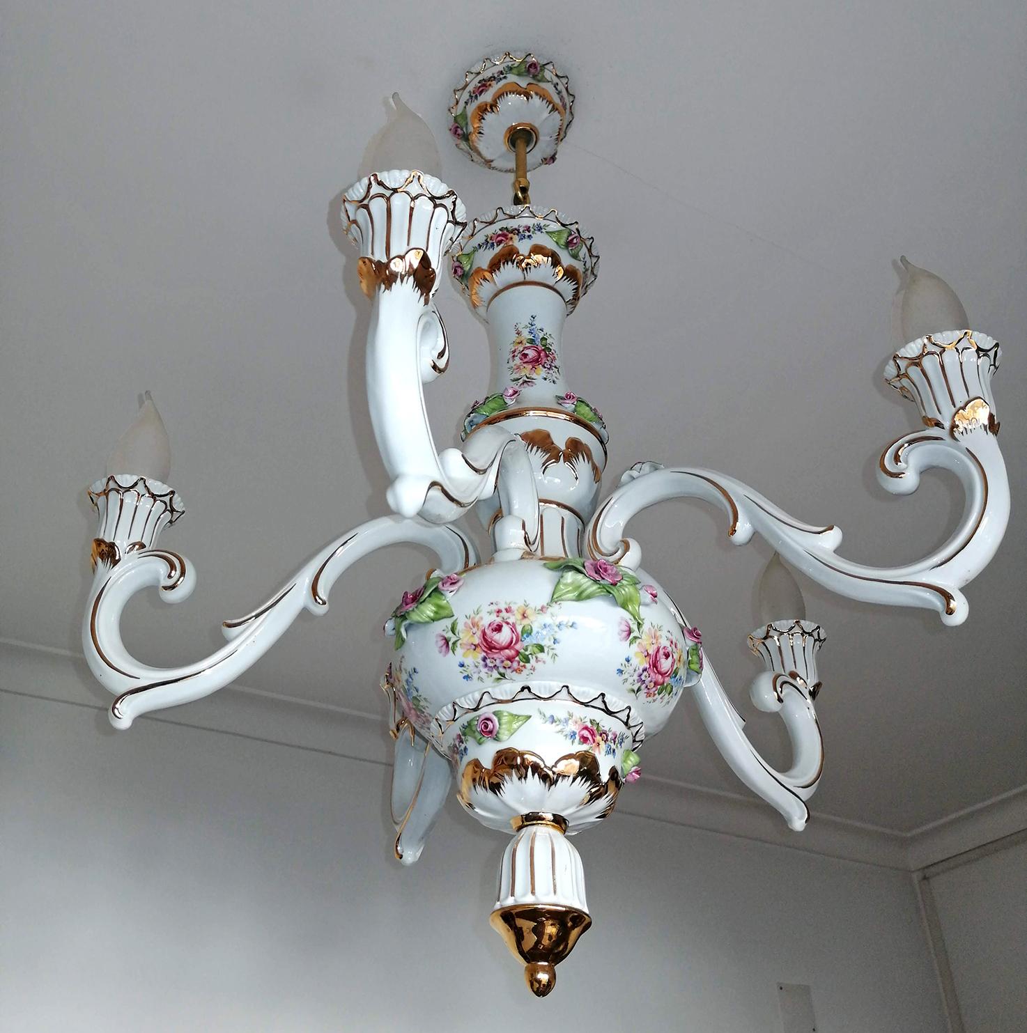 Gorgeous French Limoges style hand painted porcelain chandelier with five-light bulbs and sculpted applique porcelain roses, leaves and gilt brass
Measures:
Diameter 23.6 in/ 60 cm
Height 29.5 in/ 75 cm, chain (20 cm)
Weight: 10 lb/ 5 Kg
Five light