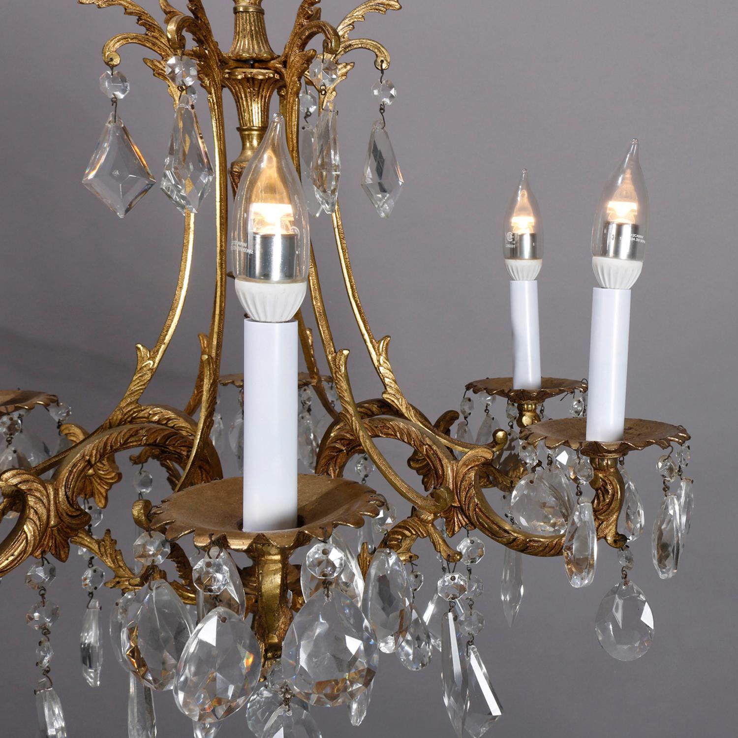 A French Louis XIV crystal chandelier offers gilt bronze foliate form frame with S-scroll arms terminating in candle lights, hanging cut crystal highlights throughout, 20th century

***DELIVERY NOTICE – Due to COVID-19 we are employing NO-CONTACT