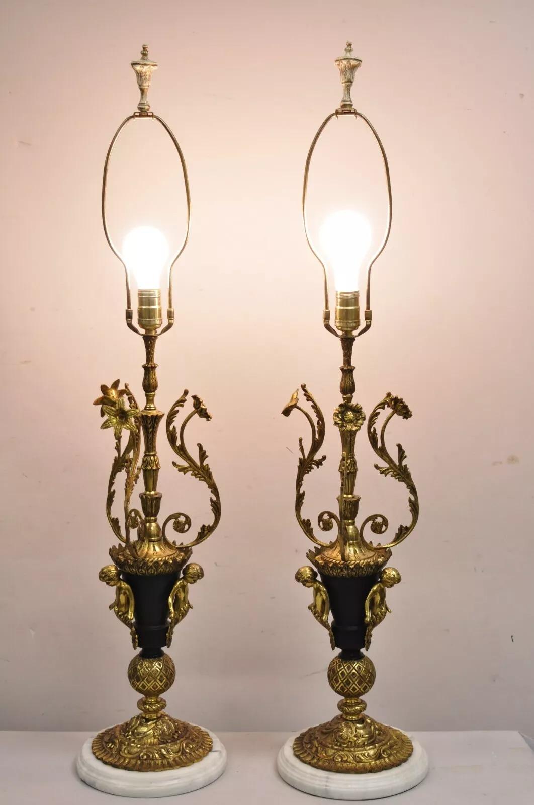 Vintage French Louis XV Style Brass & Marble Tall Figural Table Lamps with Triple Cherubs and Black Tole Metal Accents - a Pair. Circa Mid 20th Century. Measurements: 40.5