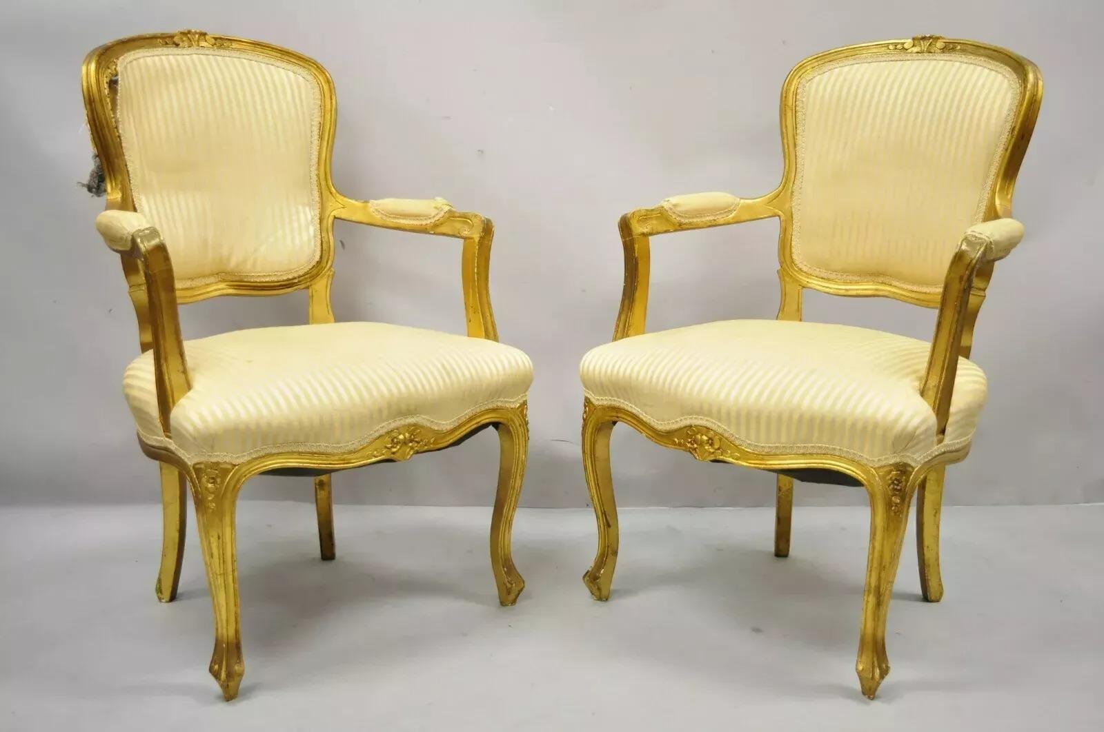 Vintage French Louis XV Style Gold Gilt Wood Arm Chairs to Refinish DIY - a Pair. Item features solid wood construction, upholstered armrests, gold distressed finish, cabriole legs, great style and form. Circa Late 20th Century. Measurements: 37.5