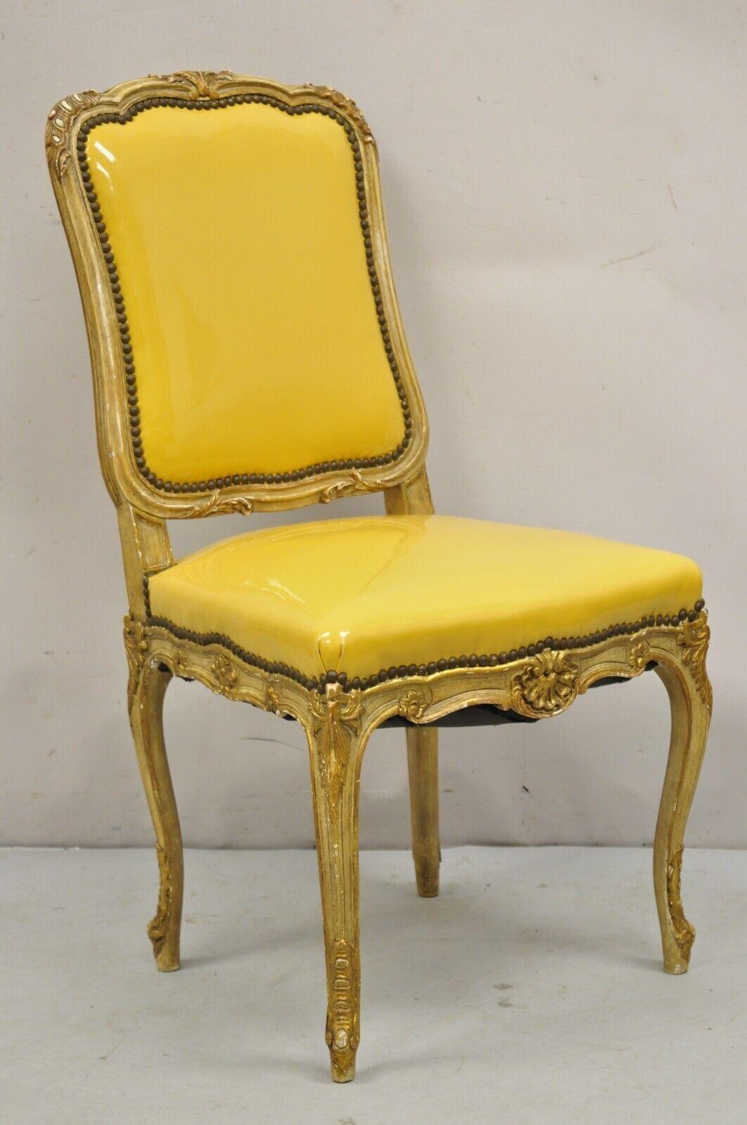 Vintage French Louis XV Style Parcel Gilt Carved Dining Side Chairs - Set of 10.  Item features is a very rare set of 10 armless dining chairs, parcel gilt carved frames, cream and burnished gold distressed finish, carved cabriole legs, spicy