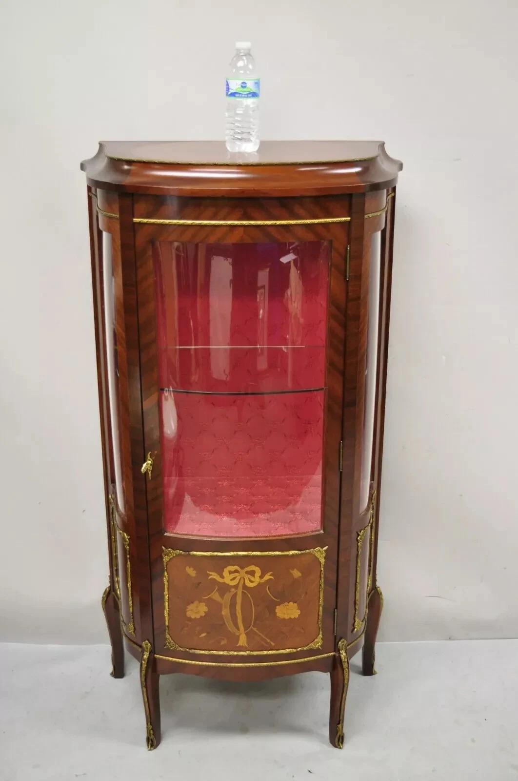Please message us with your zip code to request a more reasonable domestic U.S. shipping quote.

Vintage French Louis XV Style Small Bowed Glass Inlaid Curio Display Cabinet. Item features curved bowed glass door and side panels, floral satinwood