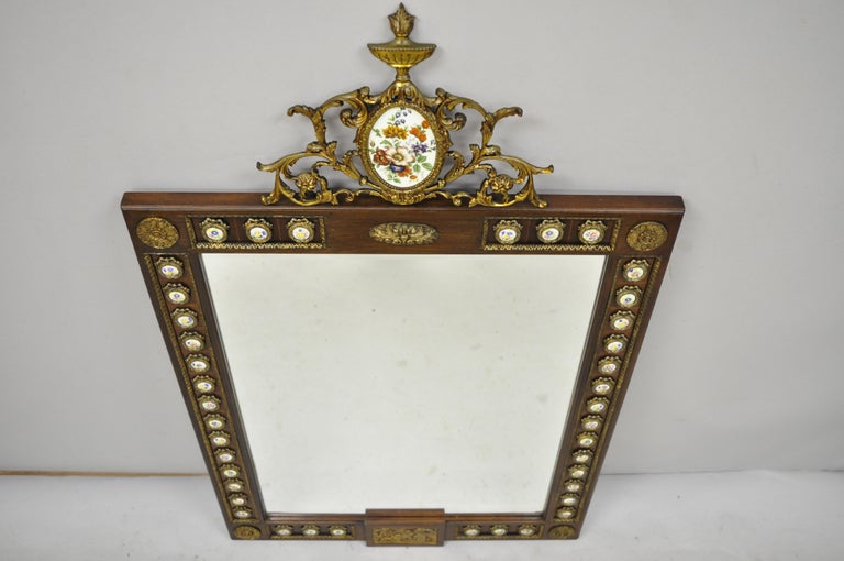 Vintage French Louis XV style console wall mirror with porcelain plaques. Item includes porcelain plaques to frame, bronze/brass ormolu, solid wood frame, beautiful wood grain, original stamp, quality craftsmanship, great style and form, circa early