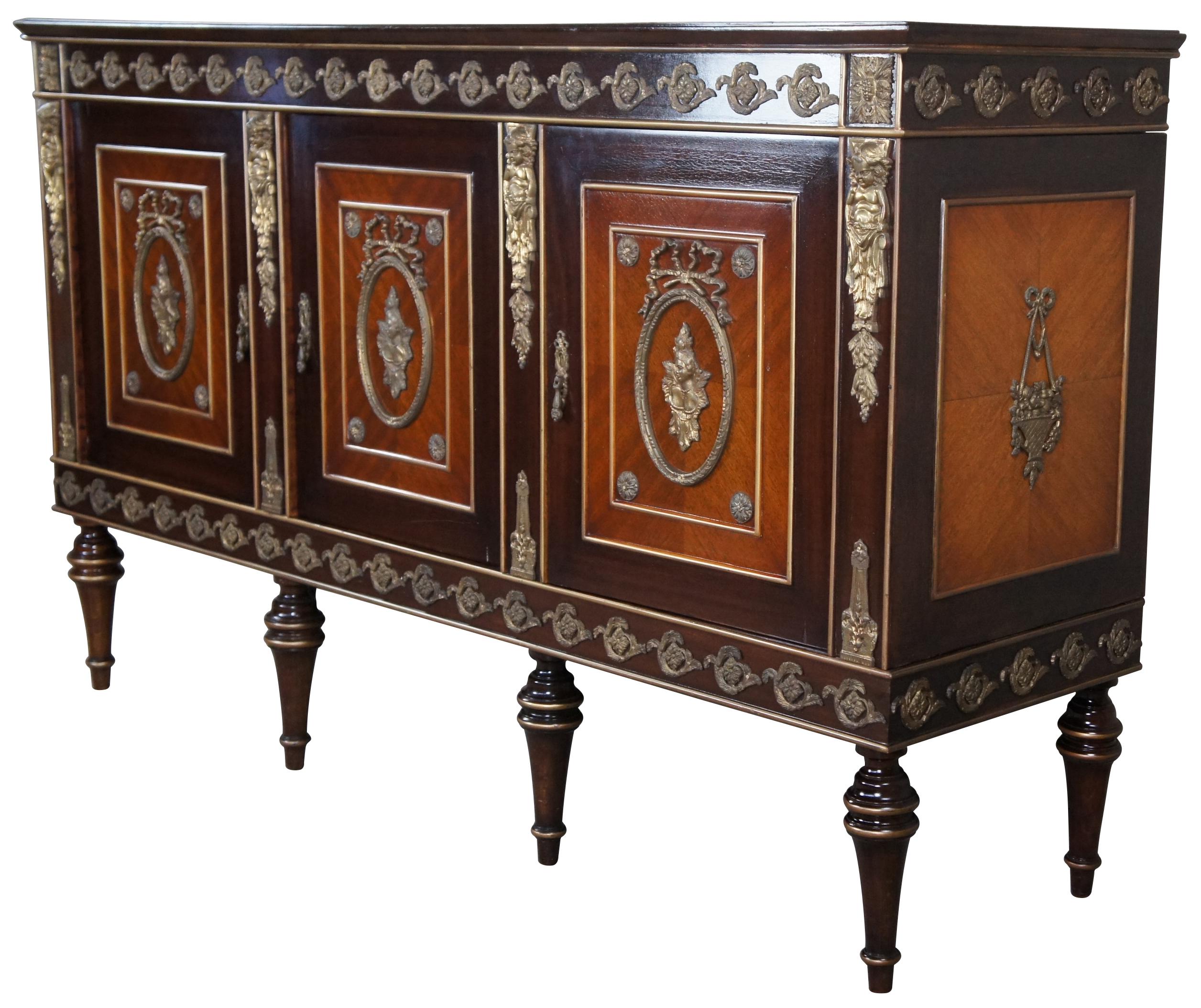 Vintage French Louis XVI inspired buffet, sideboard server or bar cabinet. Made in Cairo Egypt (Arabska Republika Egiptu) by Abbas, circa 1972. Made of mahogany with two tones and elegant matchbook veneer. Features ornate brass medallions, ormolu