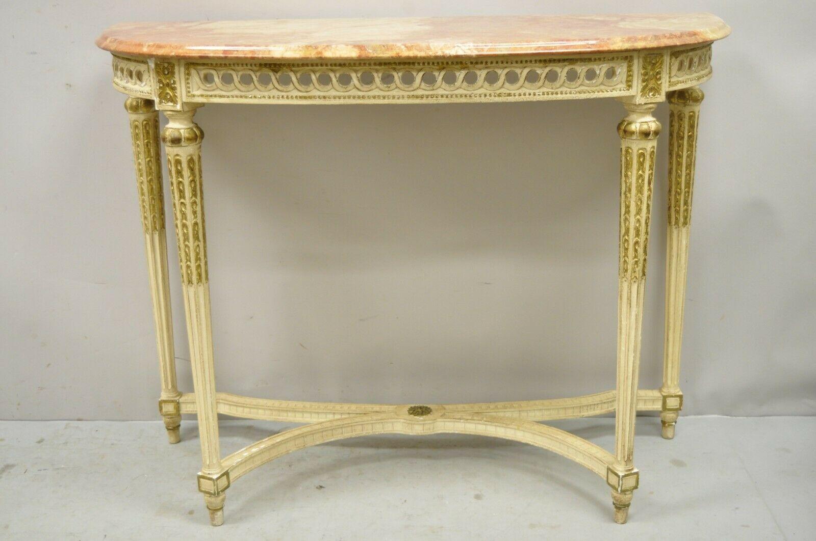 Vintage French Louis XVI Italian pink marble top demilune console hall table. Item features gold gilt details, shaped pink marble top, solid wood construction, tapered legs, quality Italian craftsmanship, great style and form. Circa Mid 20th