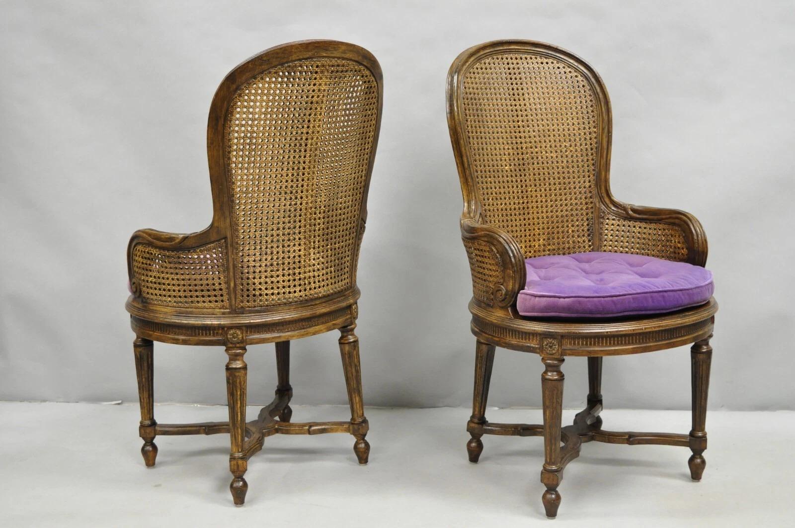 Luigi XVI Vintage French Louis XVI Style Cane Balloon Back Walnut Arm Chairs - a Pair in vendita