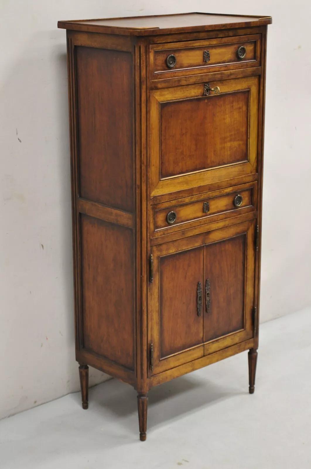 Vintage French Louis XVI Style Cherry Wood Abbatant Secretary Desk for Bloomingdale's. Item features 2 dovetailed drawers with lined interior, working locks and key, green tooled leather top writing surface, original label which reads 