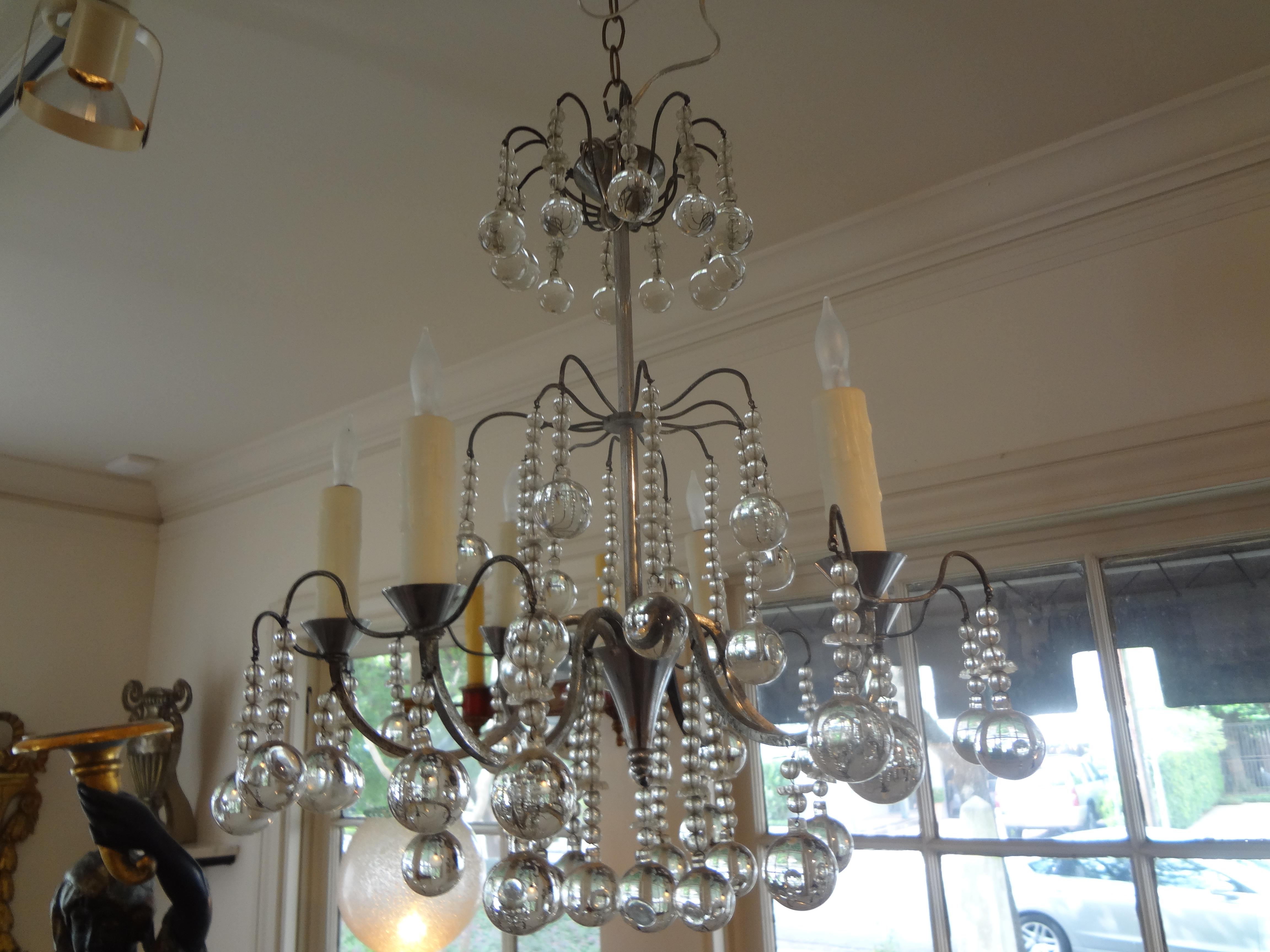 Stunning French Maison Baguès style silvered bronze and crystal chandelier. This beautiful French Louis XVI style crystal six-light chandelier has unusual sphere shaped crystals and has been newly wired for the U.S. market. Needed height can be