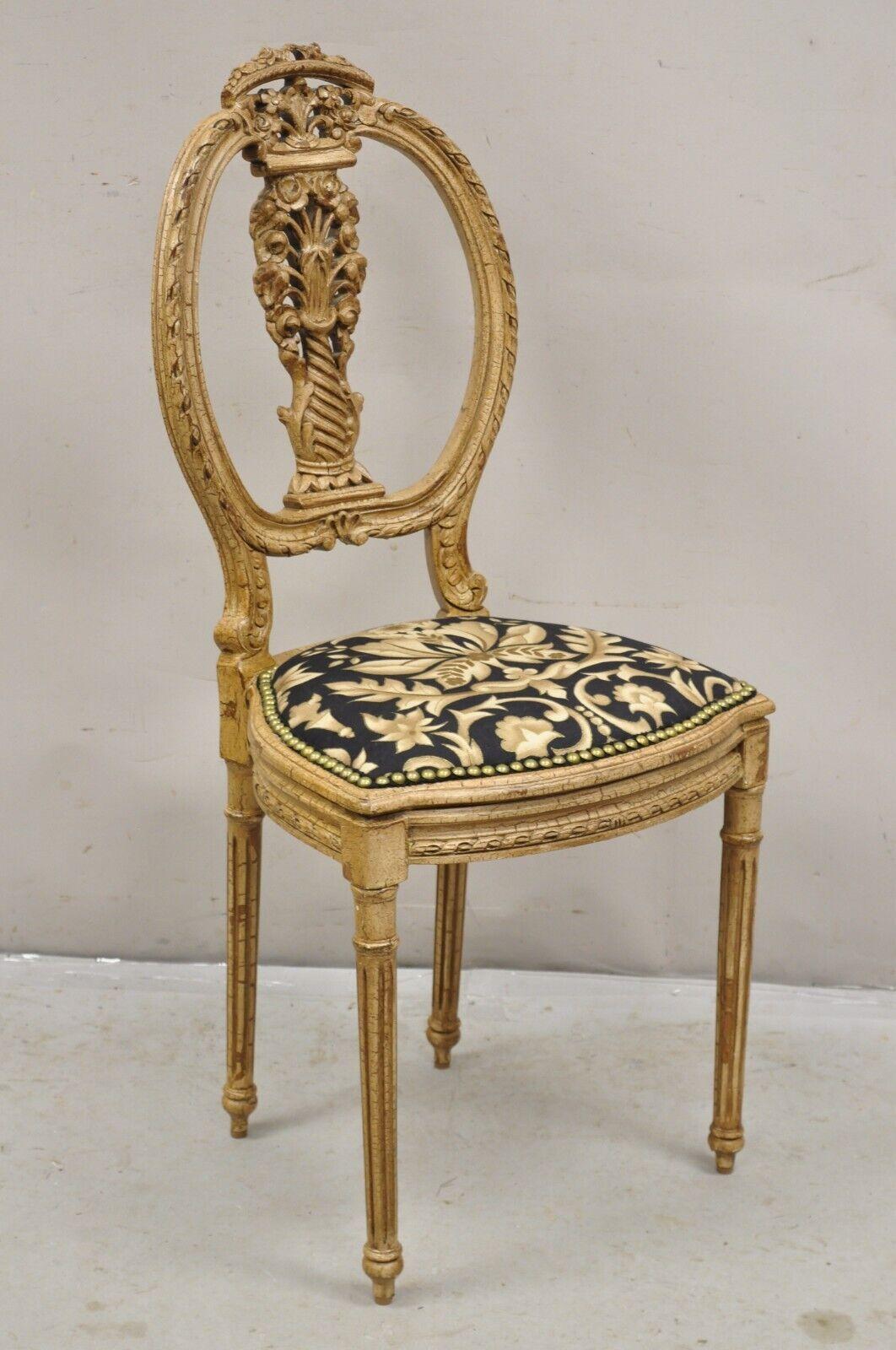 Vintage French Louis XVI Style Small Petite Carved Wood Boudoir Vanity Chair. Item features a distressed cream painted finish, nicely carved details, unique petite size.  Circa Mid 20th Century. Measurements: 31.5