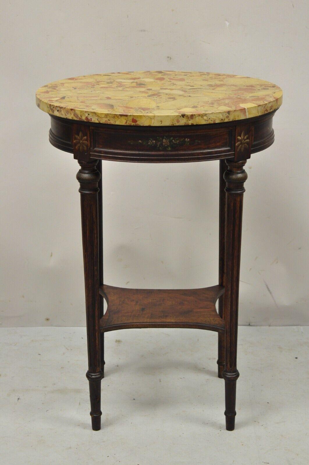 Vintage French Louis XVI style Victorian oval marble top accent side table. Item features an oval rouge marble top, hand painted floral details, lower shelf, great style and form. Circa Early 1900s. Measurements: 29