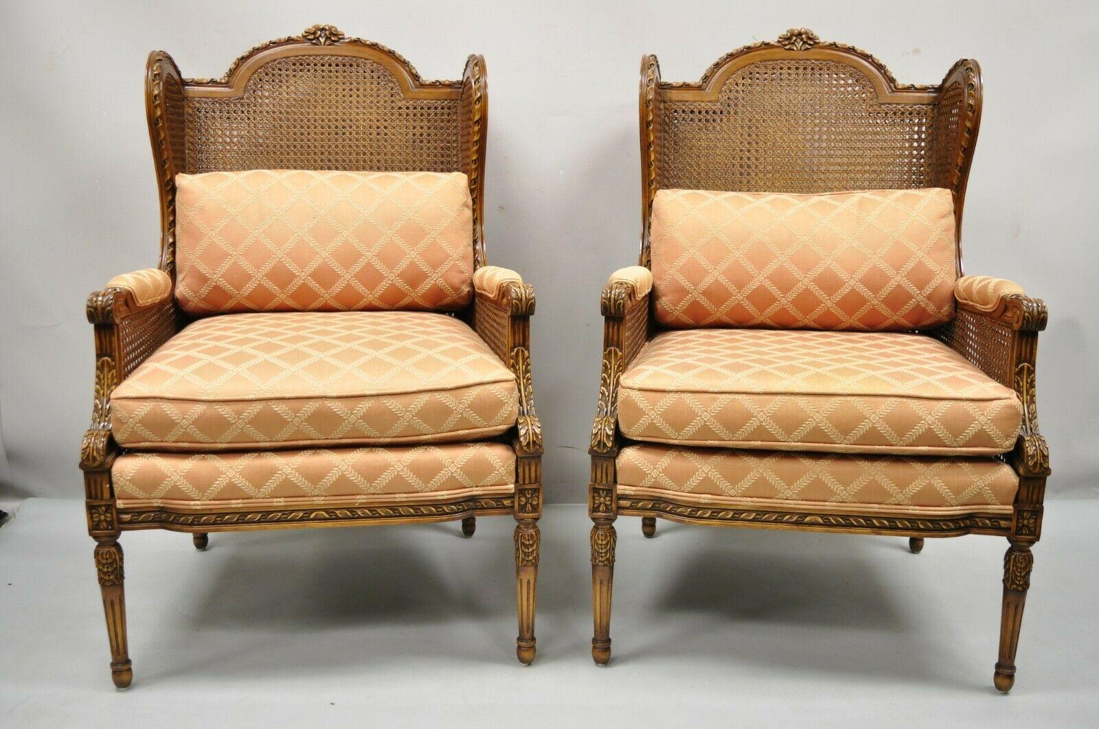Vintage French Louis XVl style cane bergere lounge chairs - a pair. Item features double cane solid wood frames, beautiful wood grain, nicely carved details, tapered legs, very nice vintage pair, quality craftsmanship, great style and form. Circa