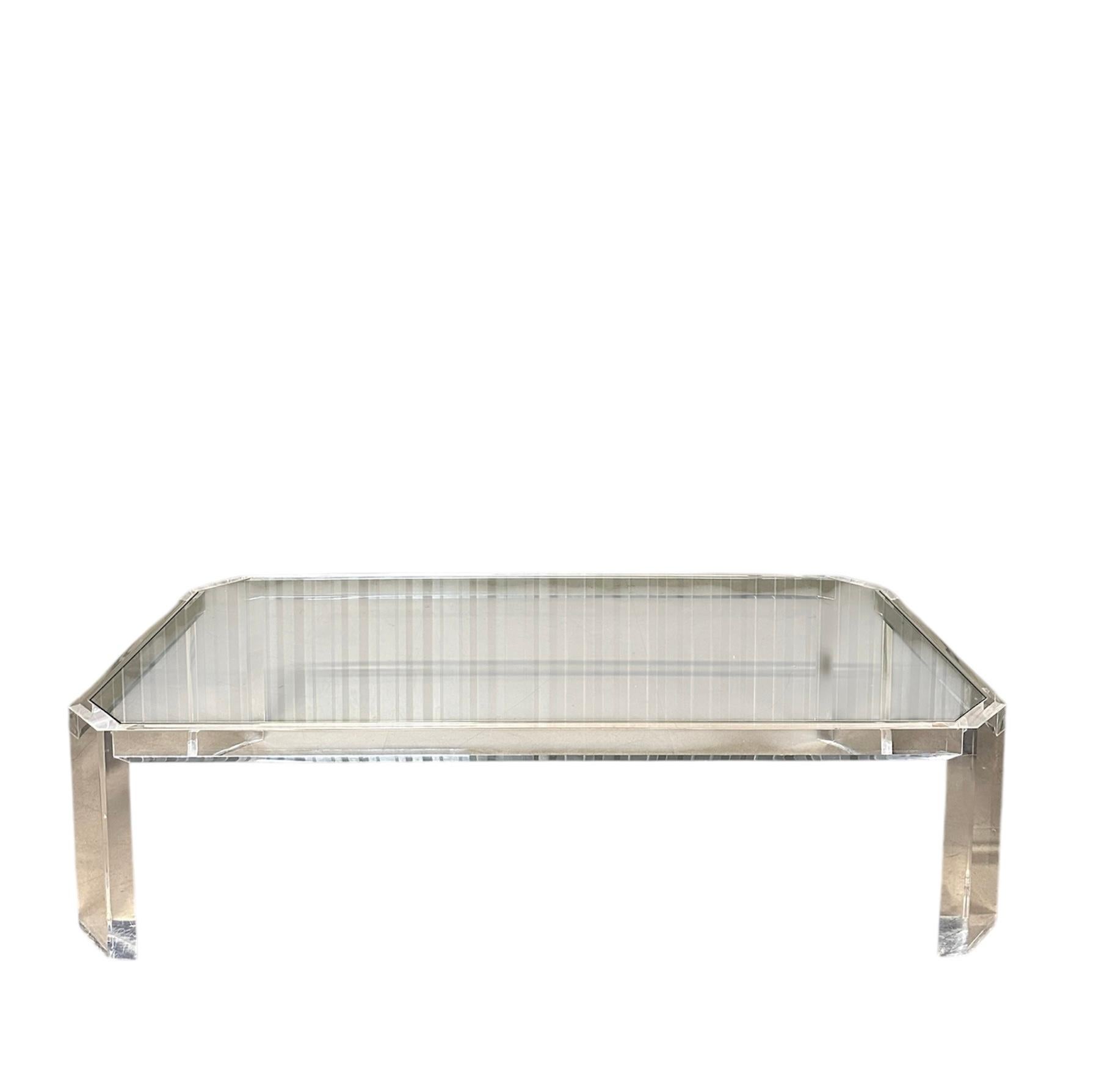 A very stylish and extremely well made vintage French Lucite coffee table by David Lange, dating from the 1970’s.

This is of superb quality, it is a great size and has a gorgeous design. The clear Lucite frame gives this a light and unique