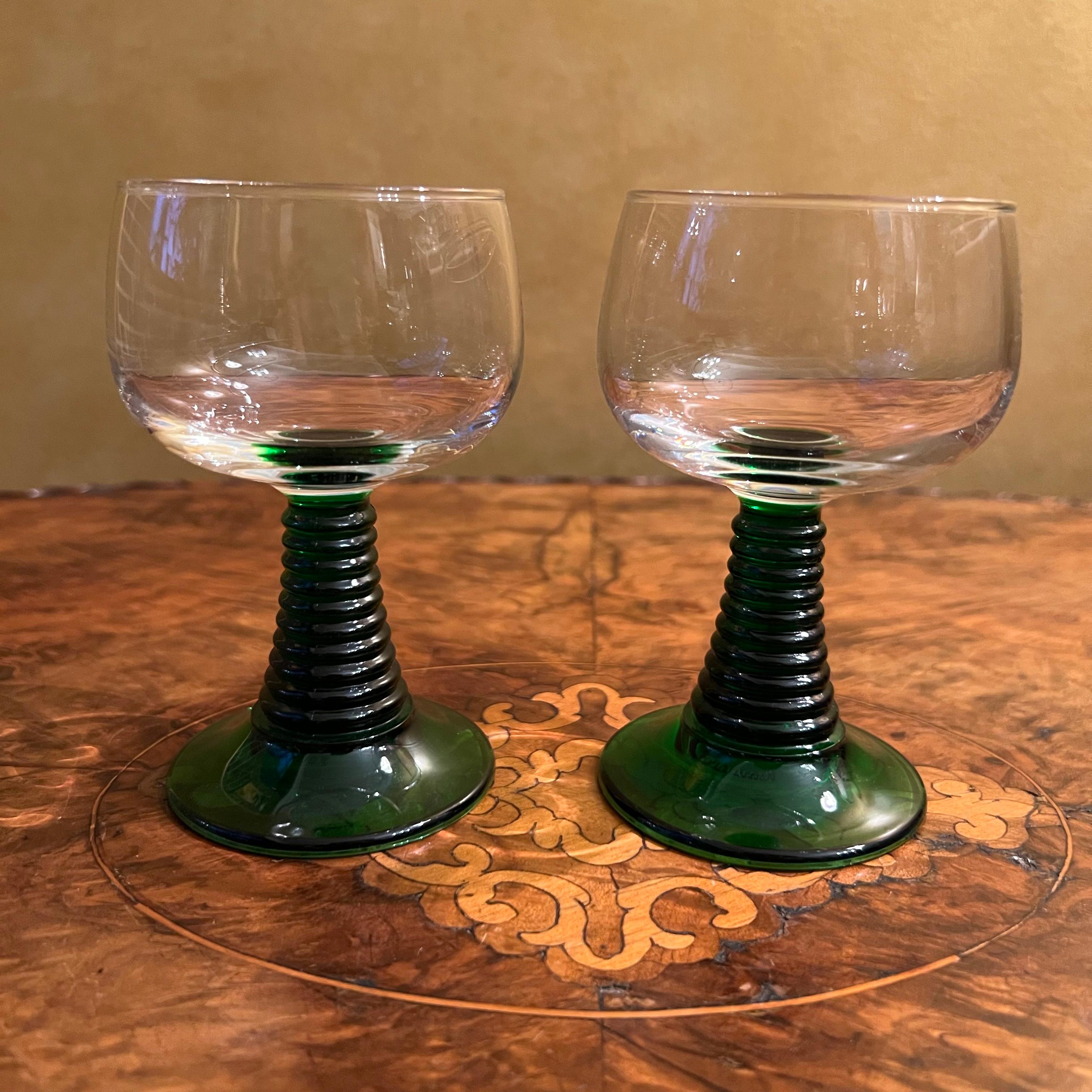 Clear tops with green stems and base, 

Circa: 1970s

Material: Glass  

Country Of Origin: France   

Measurements: 11cm high, 6cm diameter 
