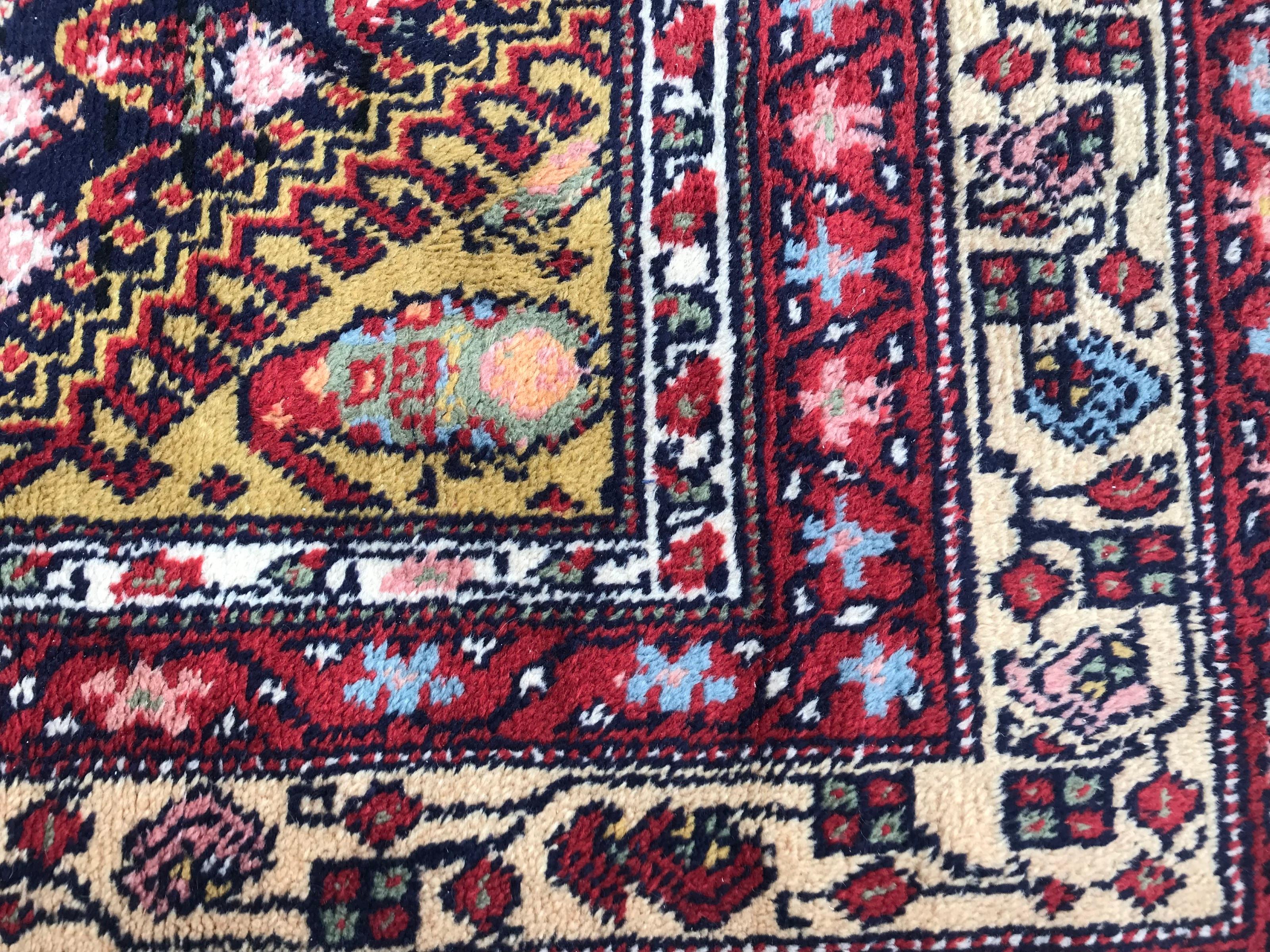 Beautiful knotted rug with a nice Malayer design and beautiful colors, entirely knotted, half manual, with wool velvet on cotton foundation.