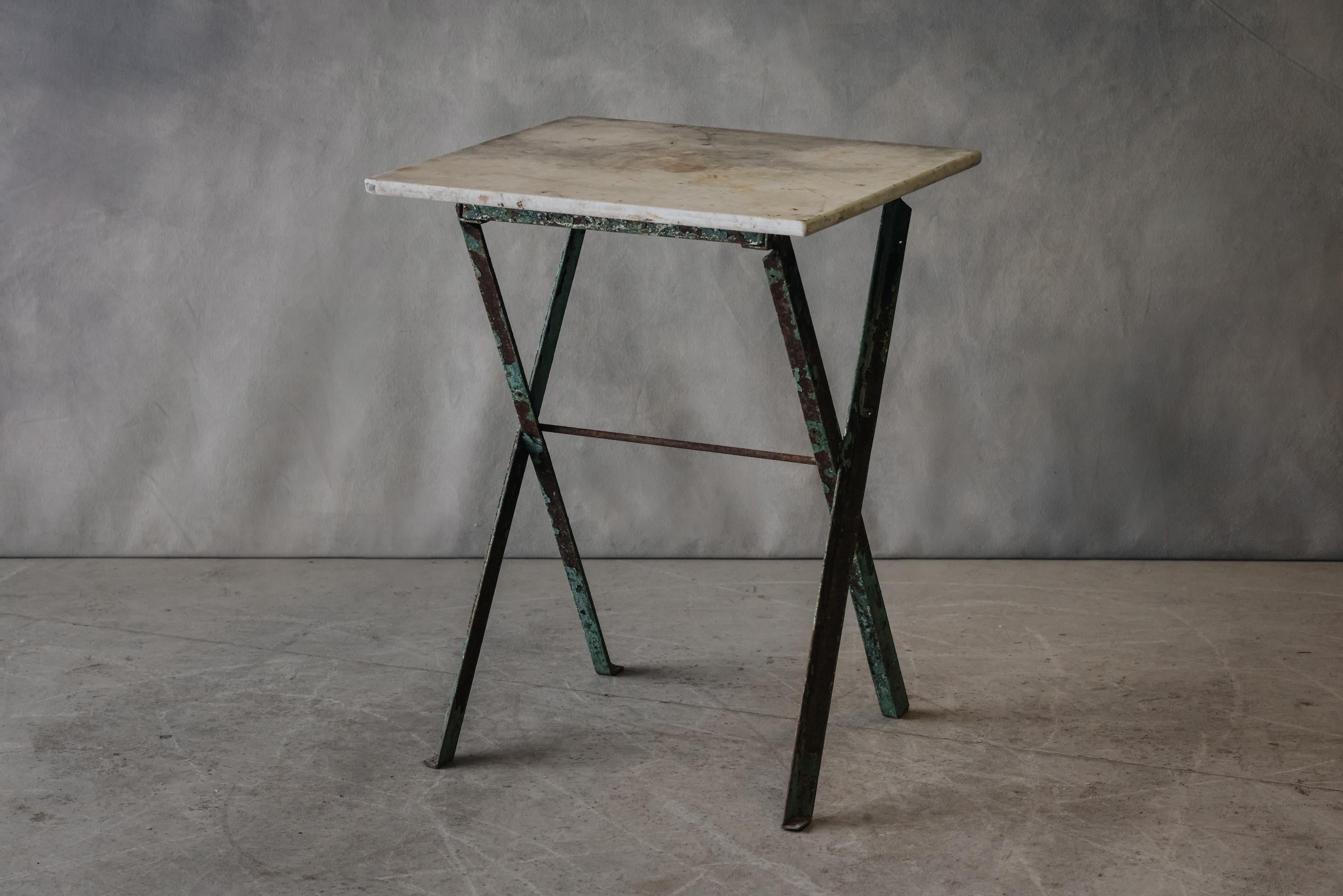 Vintage French Marble Bistro Table From France, Circa 1950.  Solid marble top on a steel base with great patina and wear.