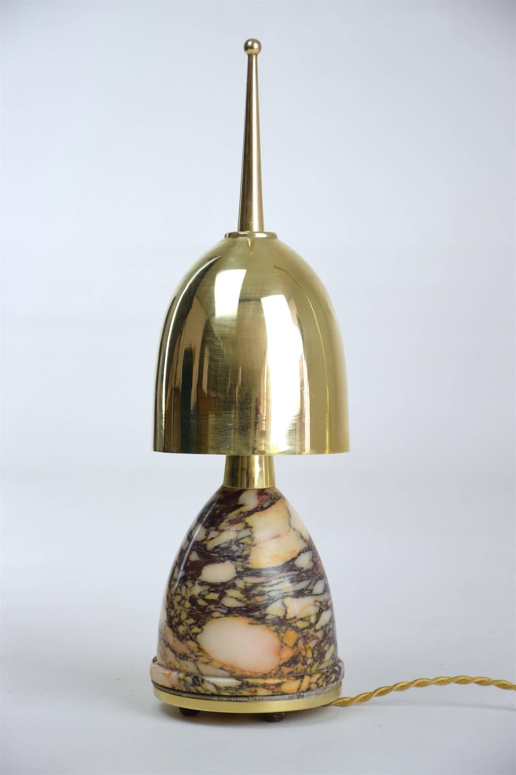 20th century vintage table lamp of small size most probably designed with parts from different ages, composed of a brass base and peculiar polished brass pointed shade.
France, circa 1980's. 

   